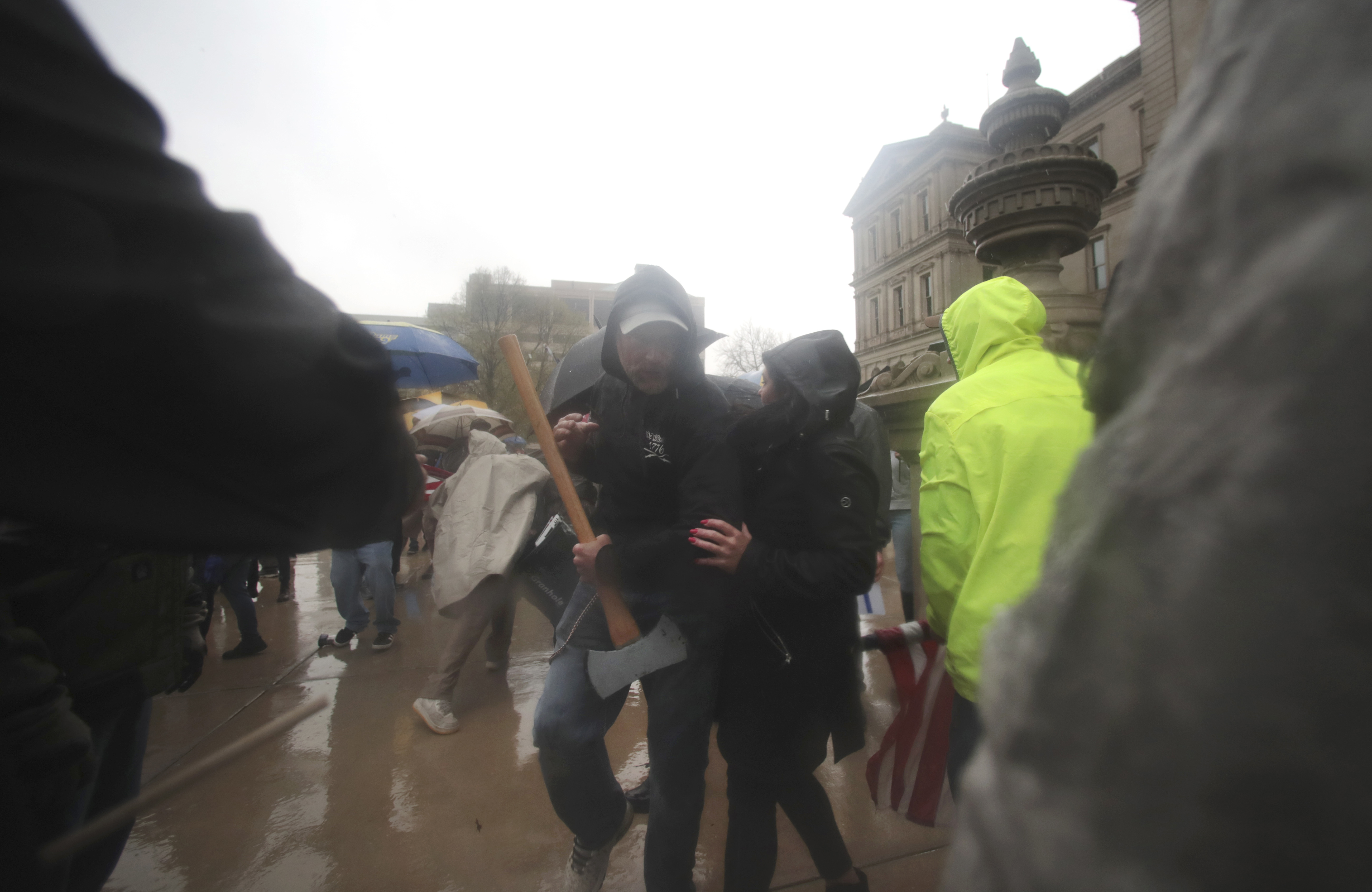 Ax-wielding man removed from Michigan anti-shutdown protests, but no citations or arrests made