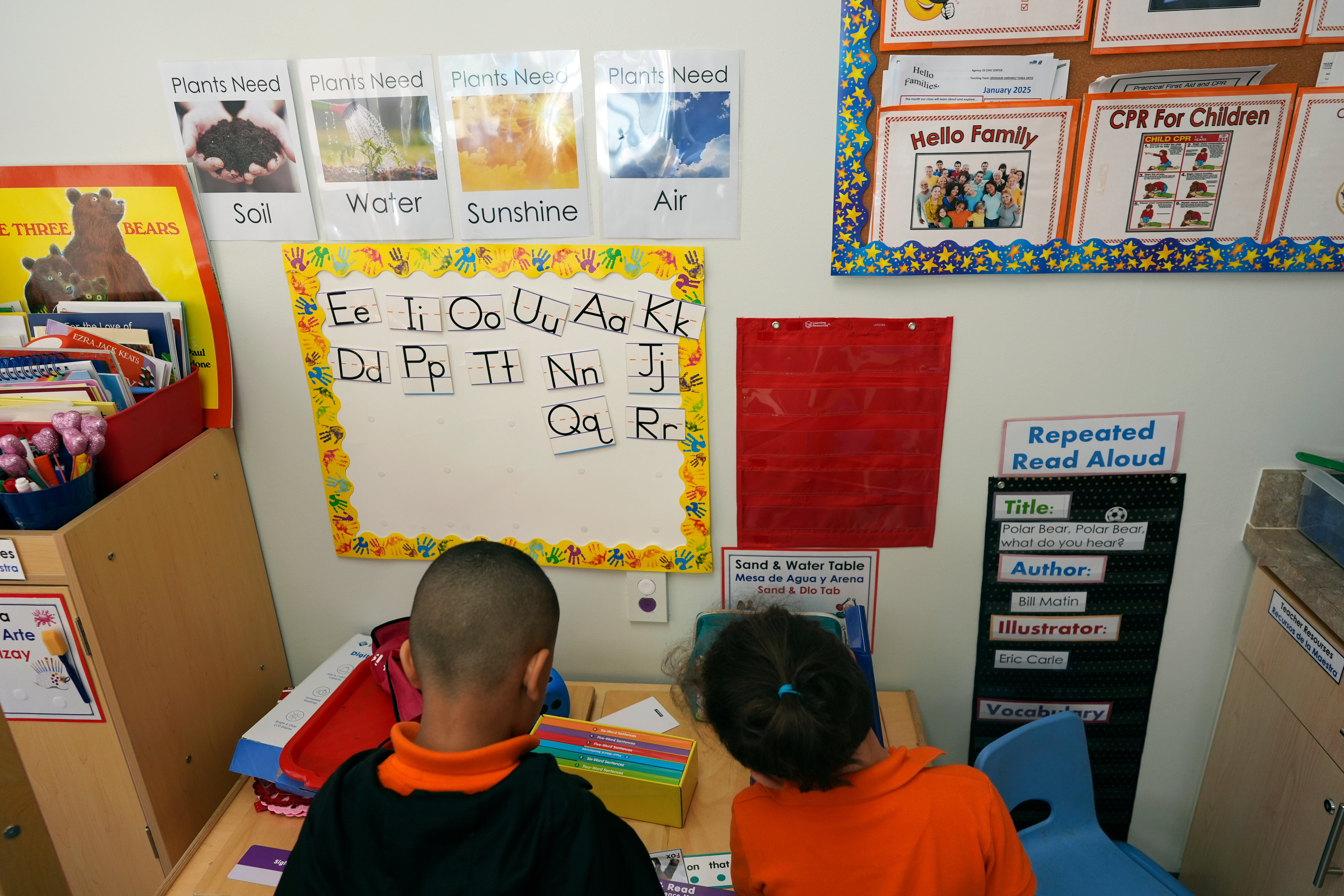 FILE - Students help put away supplies at the end of a reading and writing lesson at the Head Start program run by Easterseals, an organization that gets about a third of its funding from the federal government, Wednesday, Jan. 29, 2025, in Miami. 