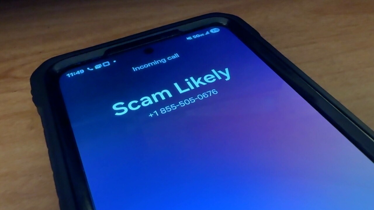 "Scam Likely" is displayed on a smartphone.