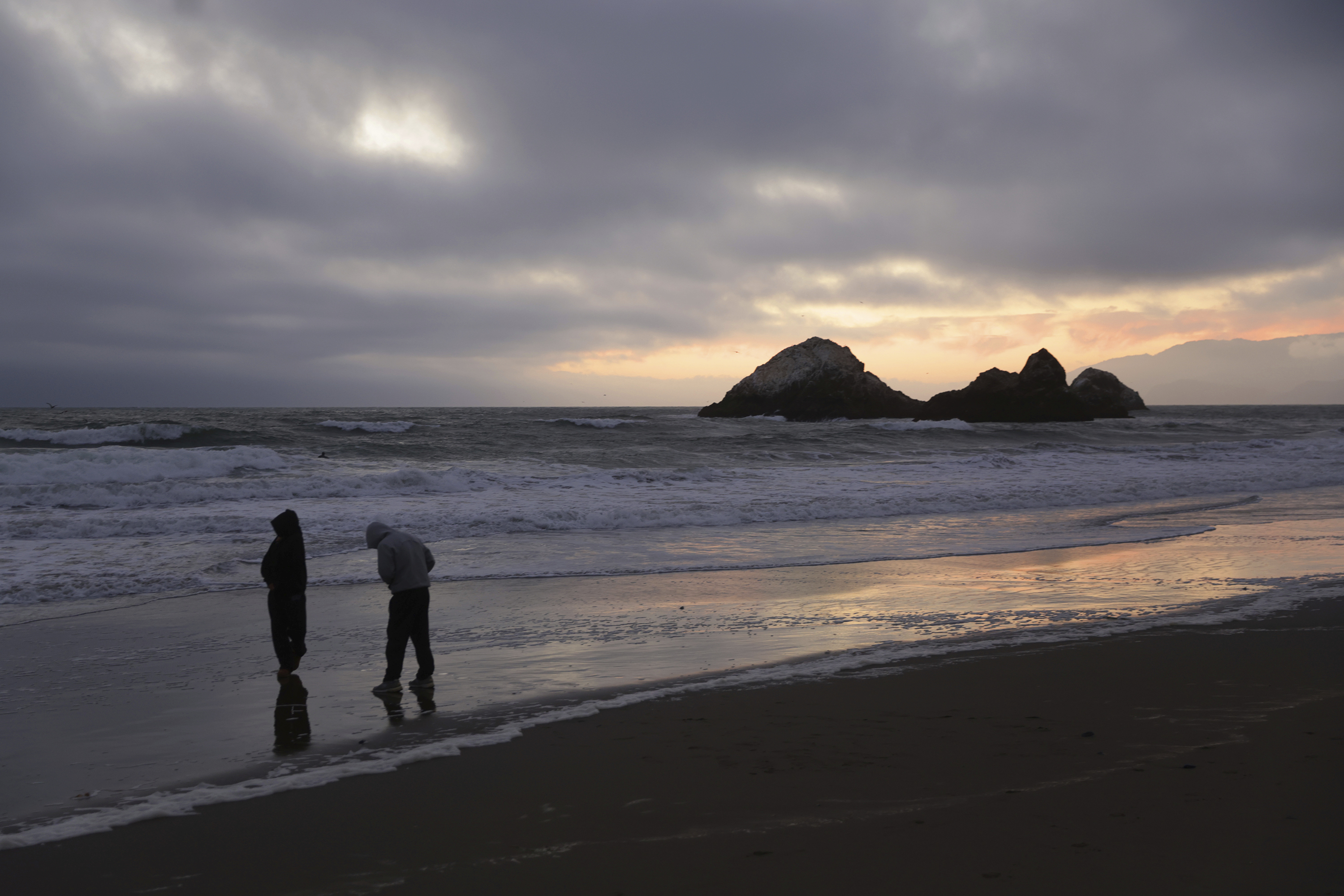 During a tsunami advisory triggered by an underwater earthquake off the coast of Russia, Gaby Lazlo and Daniel Ramirez visit Ocean Beach in San Francisco