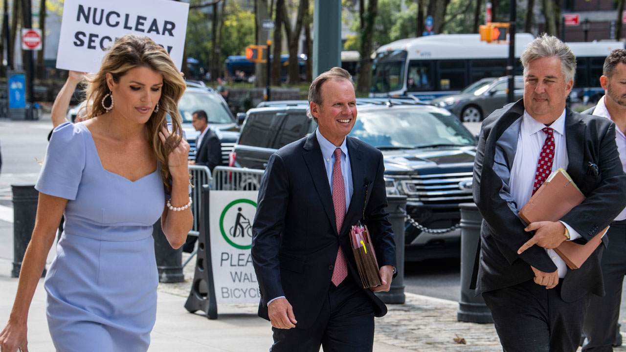 Former President Donald Trump's attorneys Linsey Halligan, James Trusty, and Chris Kise arrive at Brooklyn Federal Court on Tuesday, Sept. 20, 2022, in New York. 