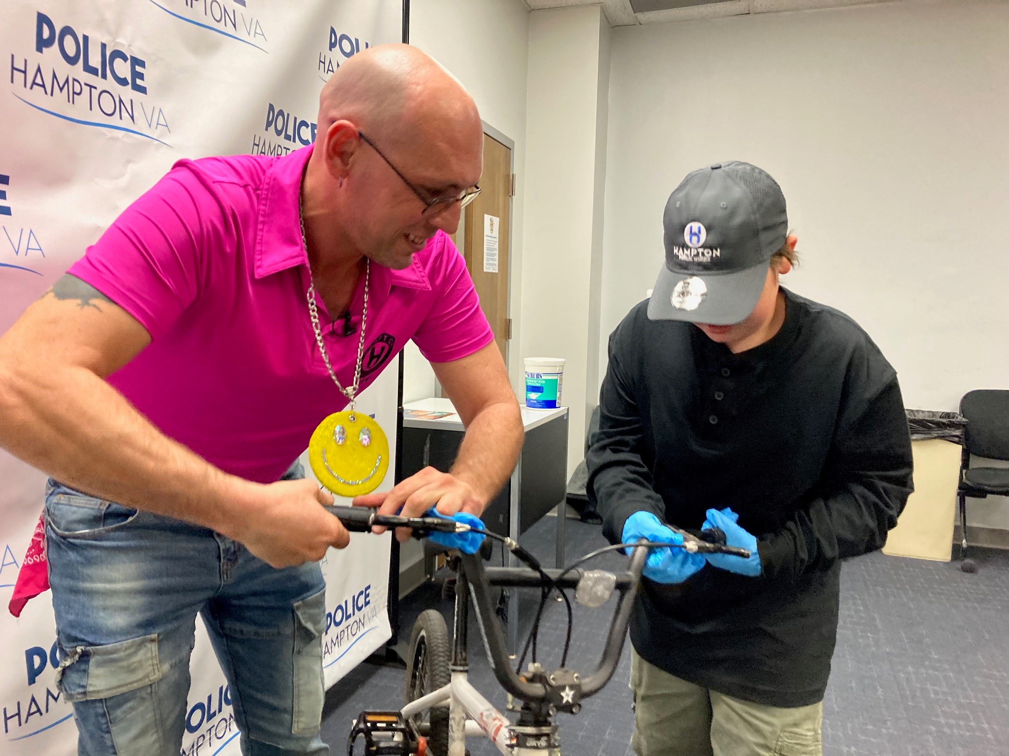 Jeff Pugh fixes up bike with friend