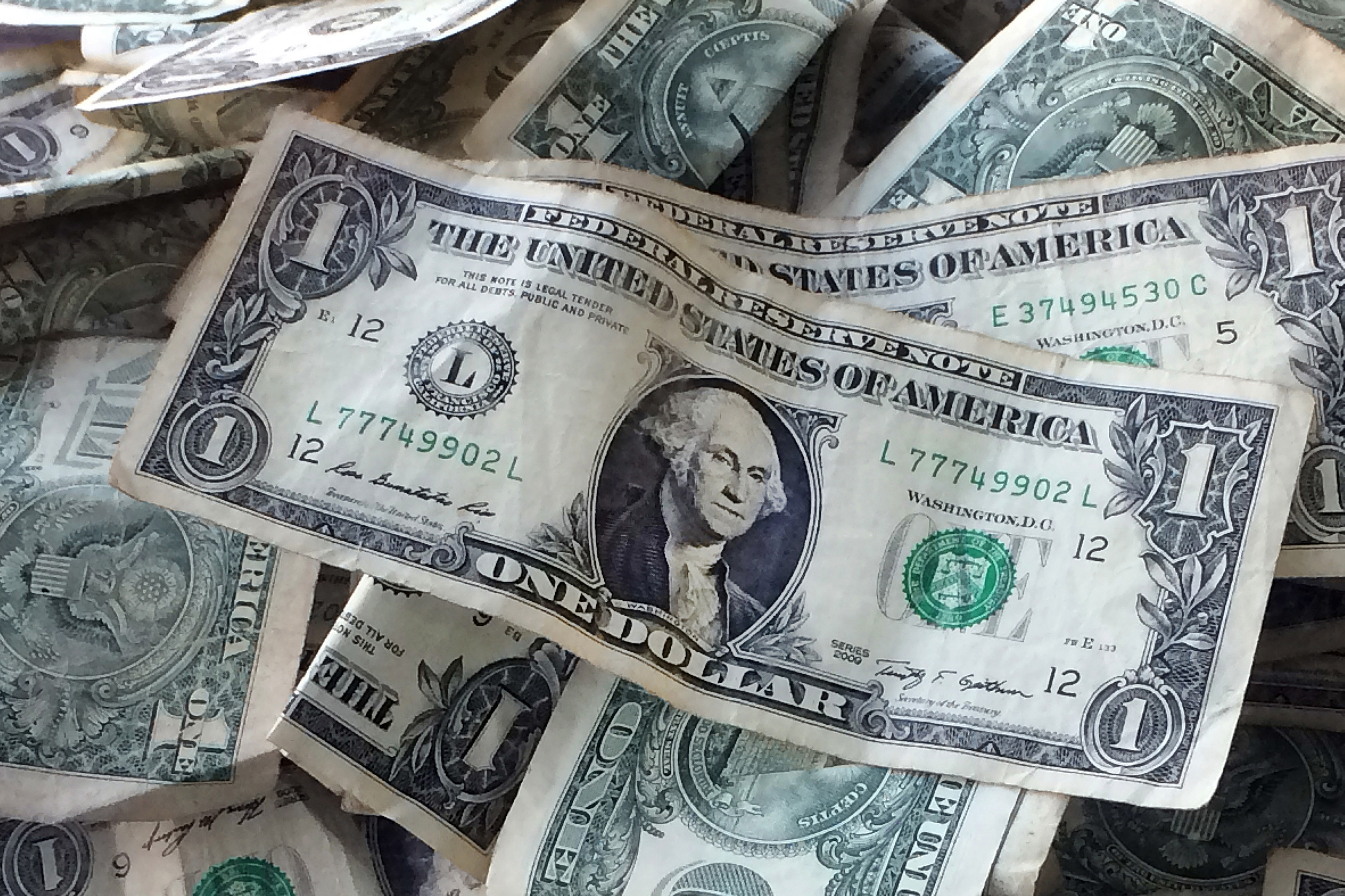 FILE - Dollar bills.