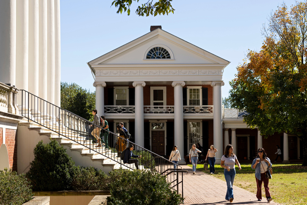 People climb steps to the Rotunda at the University of Virginia.