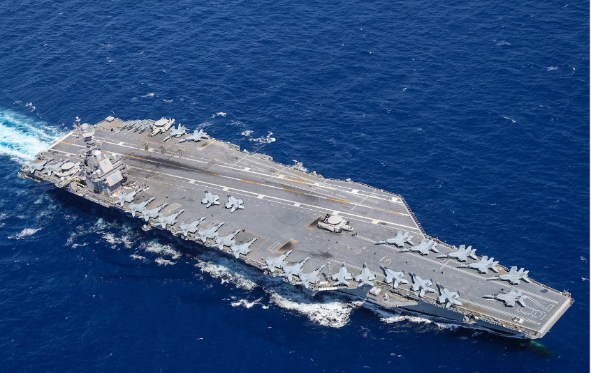 Aircraft attached to Carrier Air Wing 8 sit on USS Gerald R. Ford's flight deck as the ship steams through the Atlantic Ocean on April 13, 2022. 
