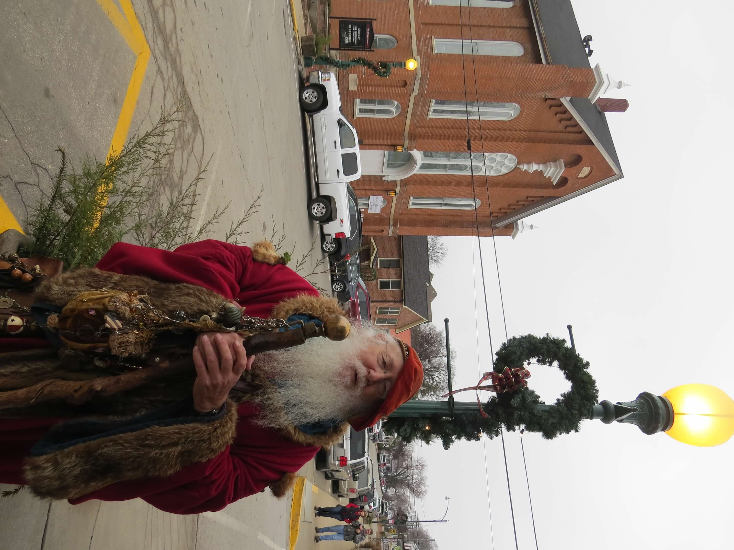 Father Christmas visits with passersby on Main Street during the holiday season.JPG