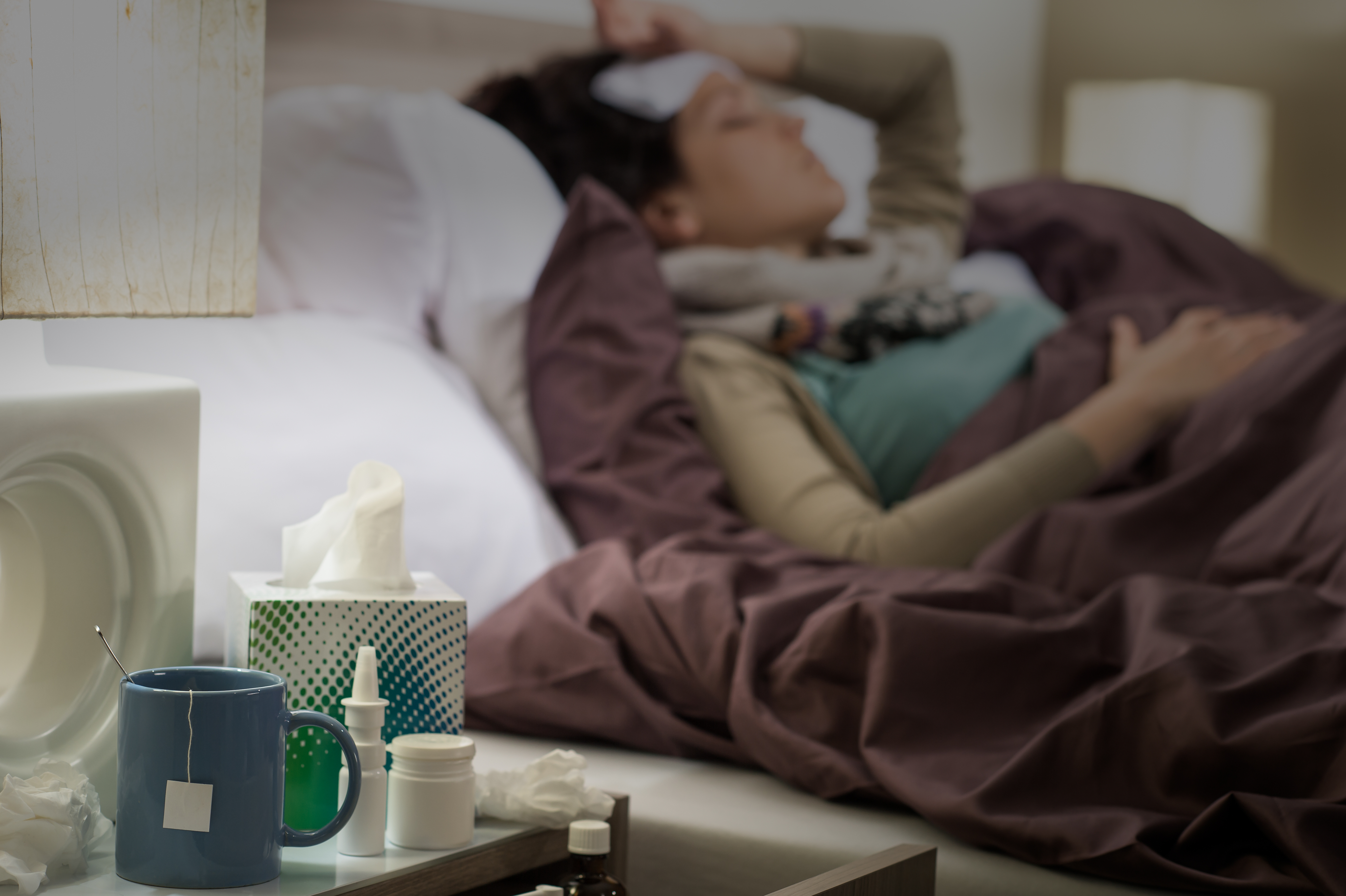 Sick woman in bed