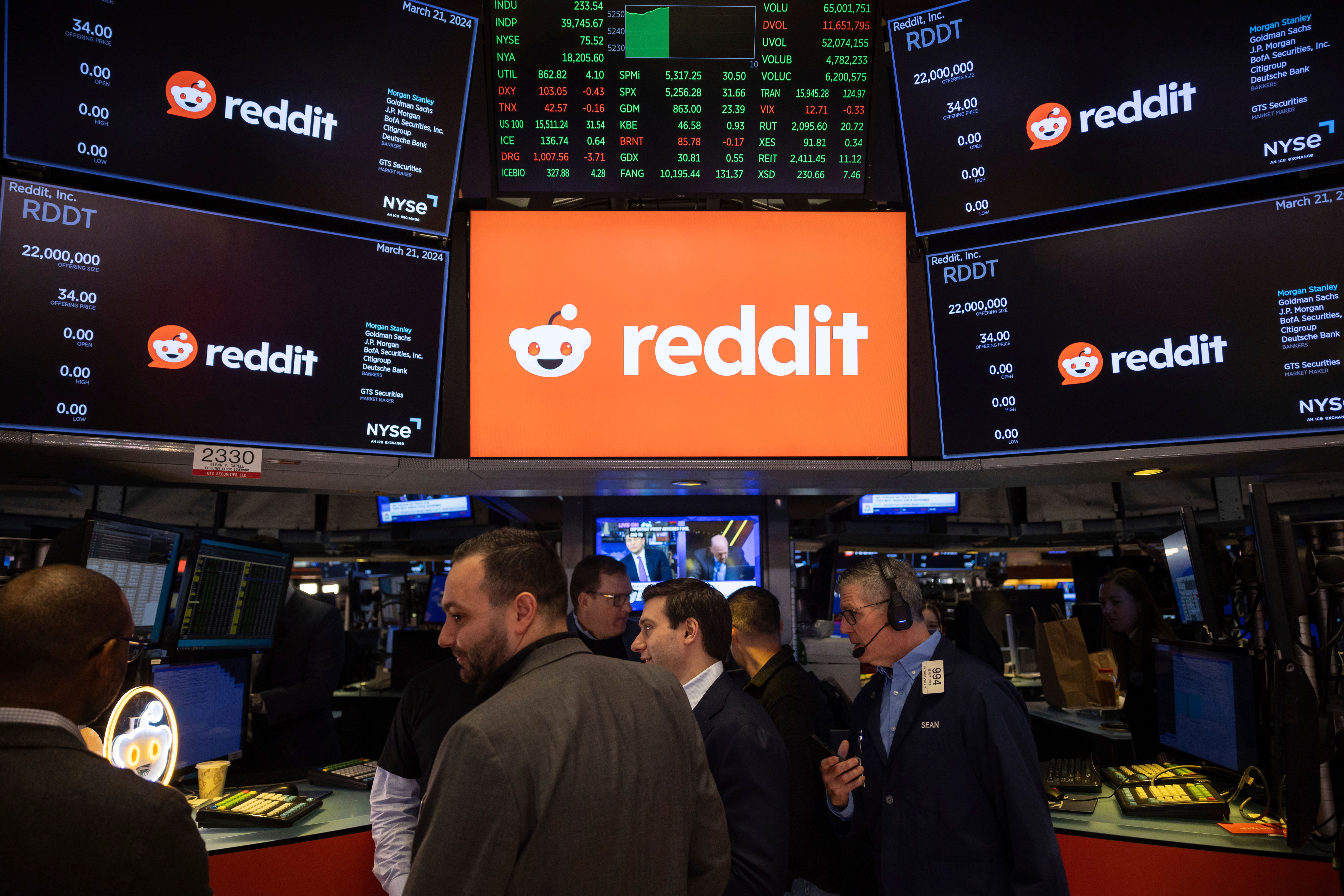 FILE - Reddit Inc. logos are displayed on the New York Stock Exchange trading floor, prior to the company's IPO, Thursday, March. 21, 2024.