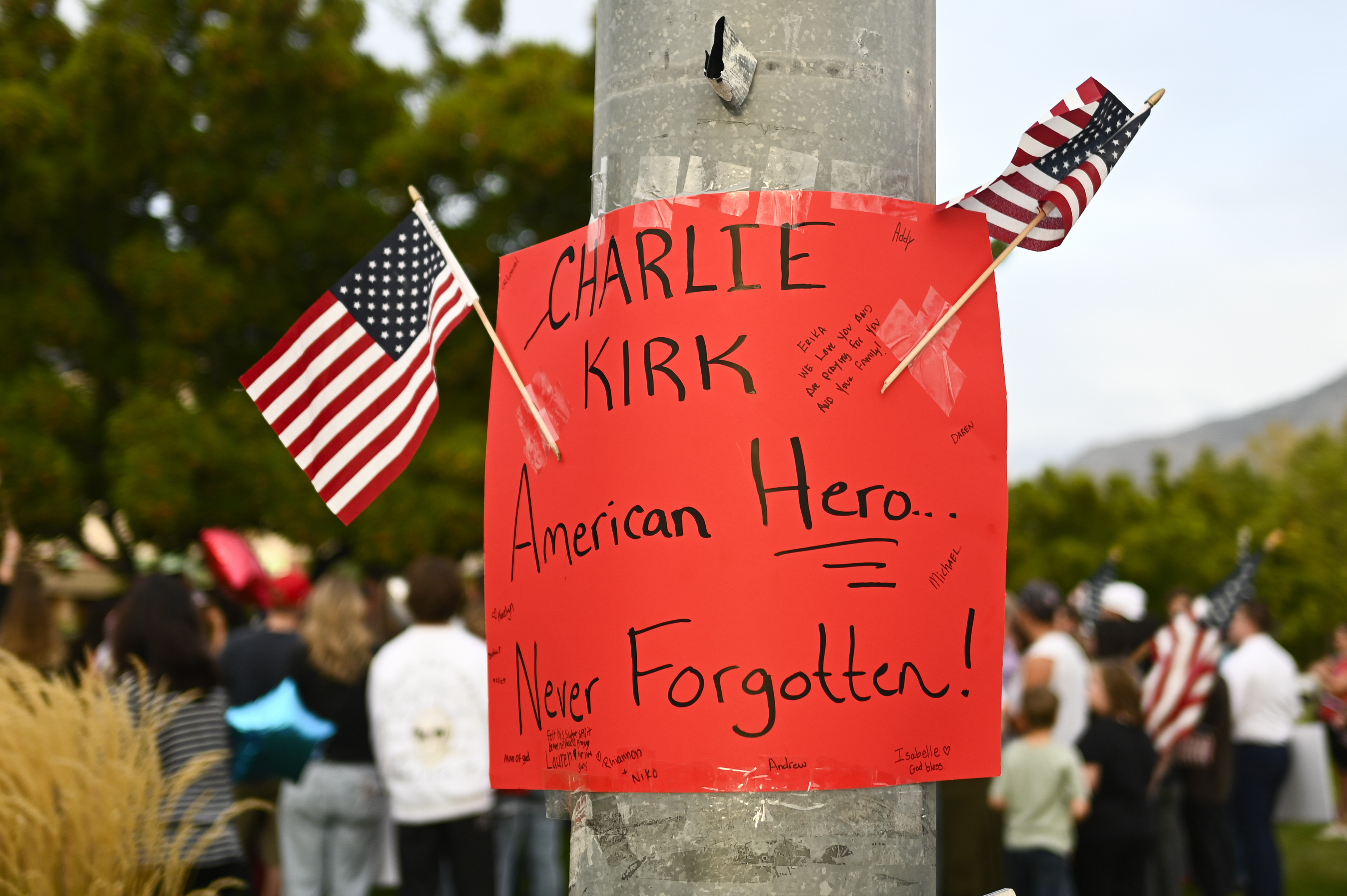 People attend a vigil for Charlie Kirk, the CEO and co-founder of Turning Point USA who was shot and killed earlier in the day, at Timpanogos Regional Hospital on Wednesday, Sept. 10, 2025, in Orem, Utah. 