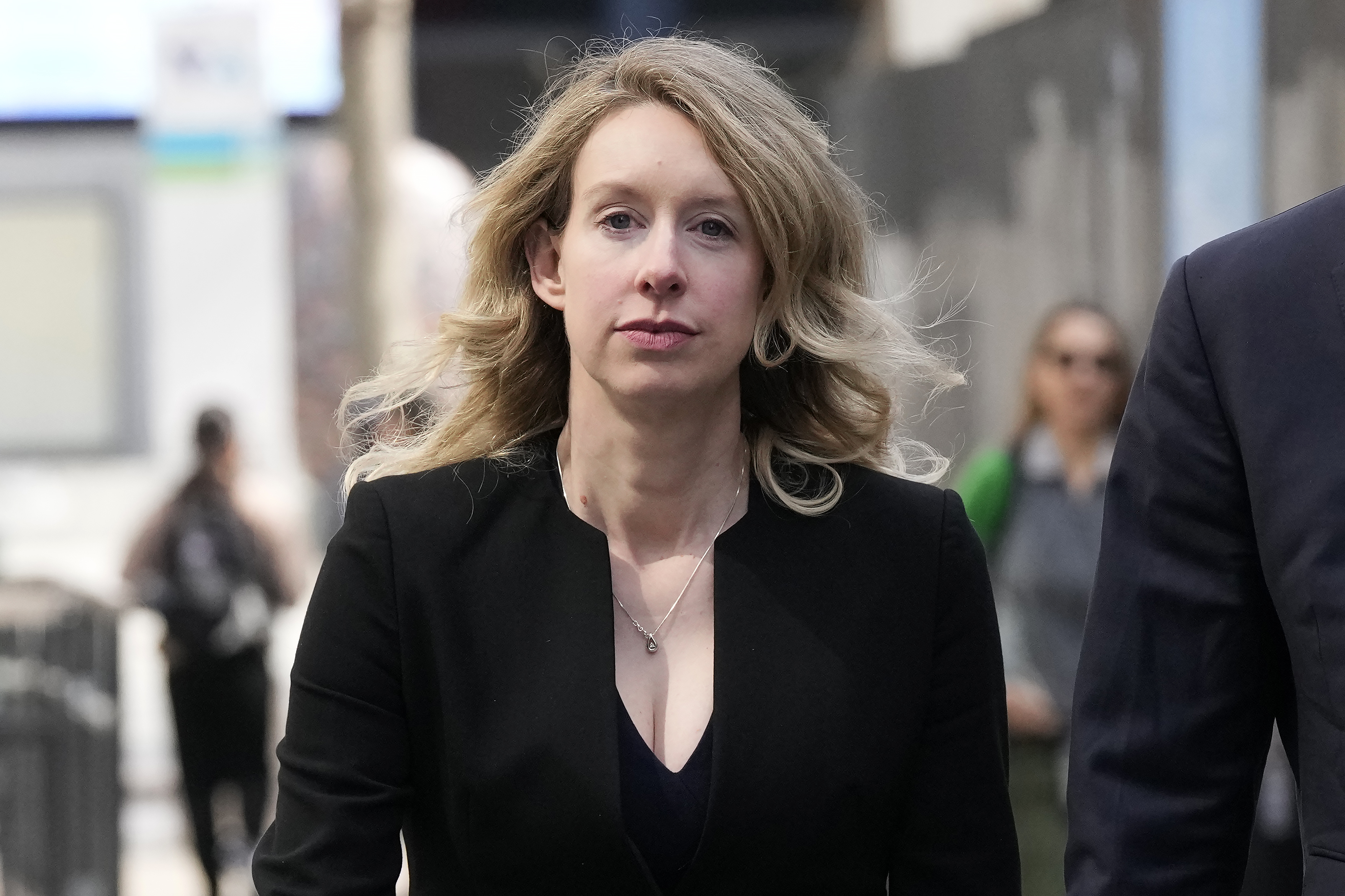FILE - Former Theranos CEO Elizabeth Holmes leaves federal court in San Jose, Calif., March 17, 2023.