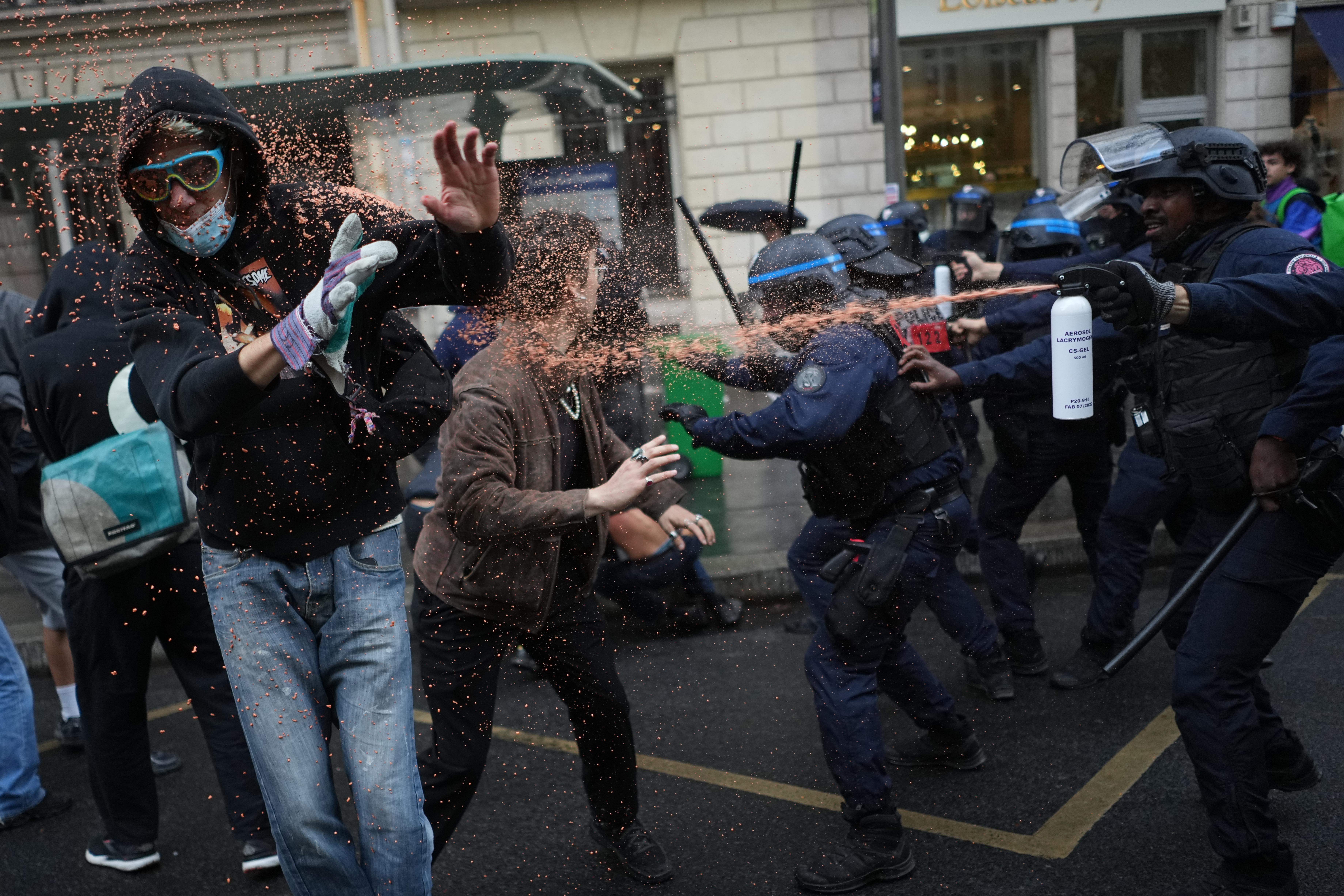 Police officers spray students with pepper spray near Sciences Po university as they protest against under-resourced schools, in Paris, Wednesday, Oct. 7, 2026.