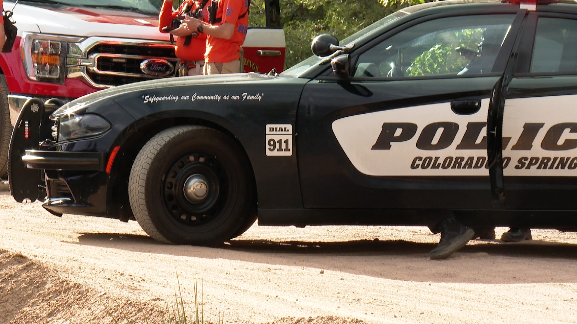First responders rescuing a motorcyclist off of Gold Camp Road