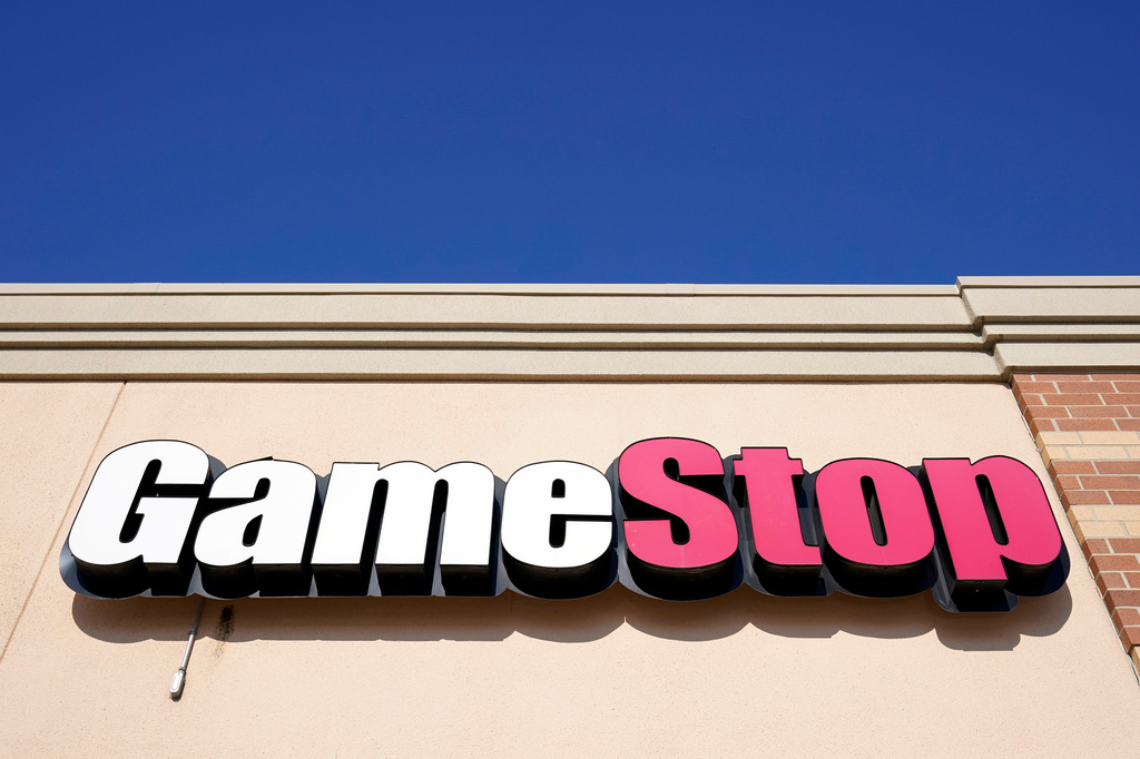 A GameStop sign is displayed above a store.