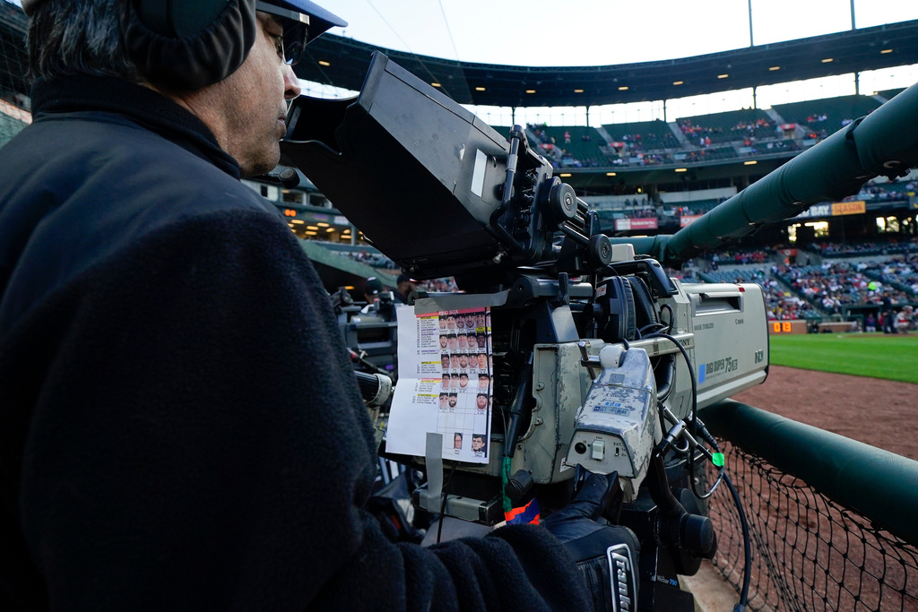 A broadcast operator works during the first inning of a baseball game between the Baltimore Orioles and the Boston Red Sox.