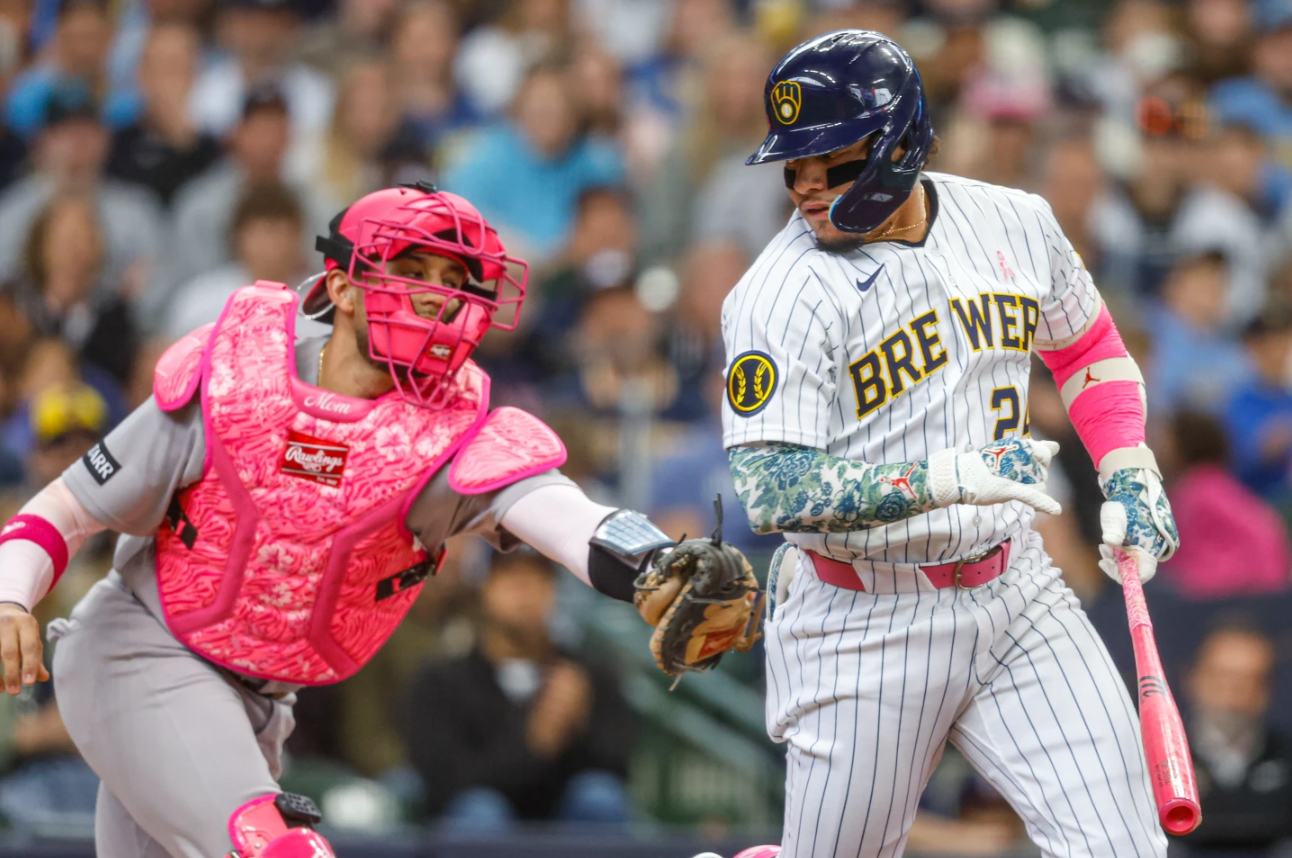 New York Yankees catcher J.C. Escarra tags out Milwaukee Brewers' William Contreras after he struck out during the first inning of a baseball game Sunday, May 10, 2026, in Milwaukee.