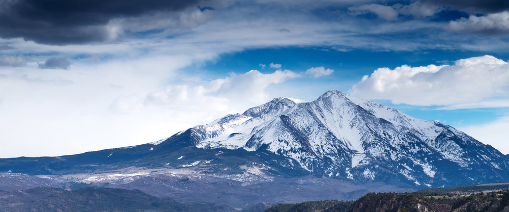 Aspen,Mountain,In,Colorado,With,Turbulent,Sky