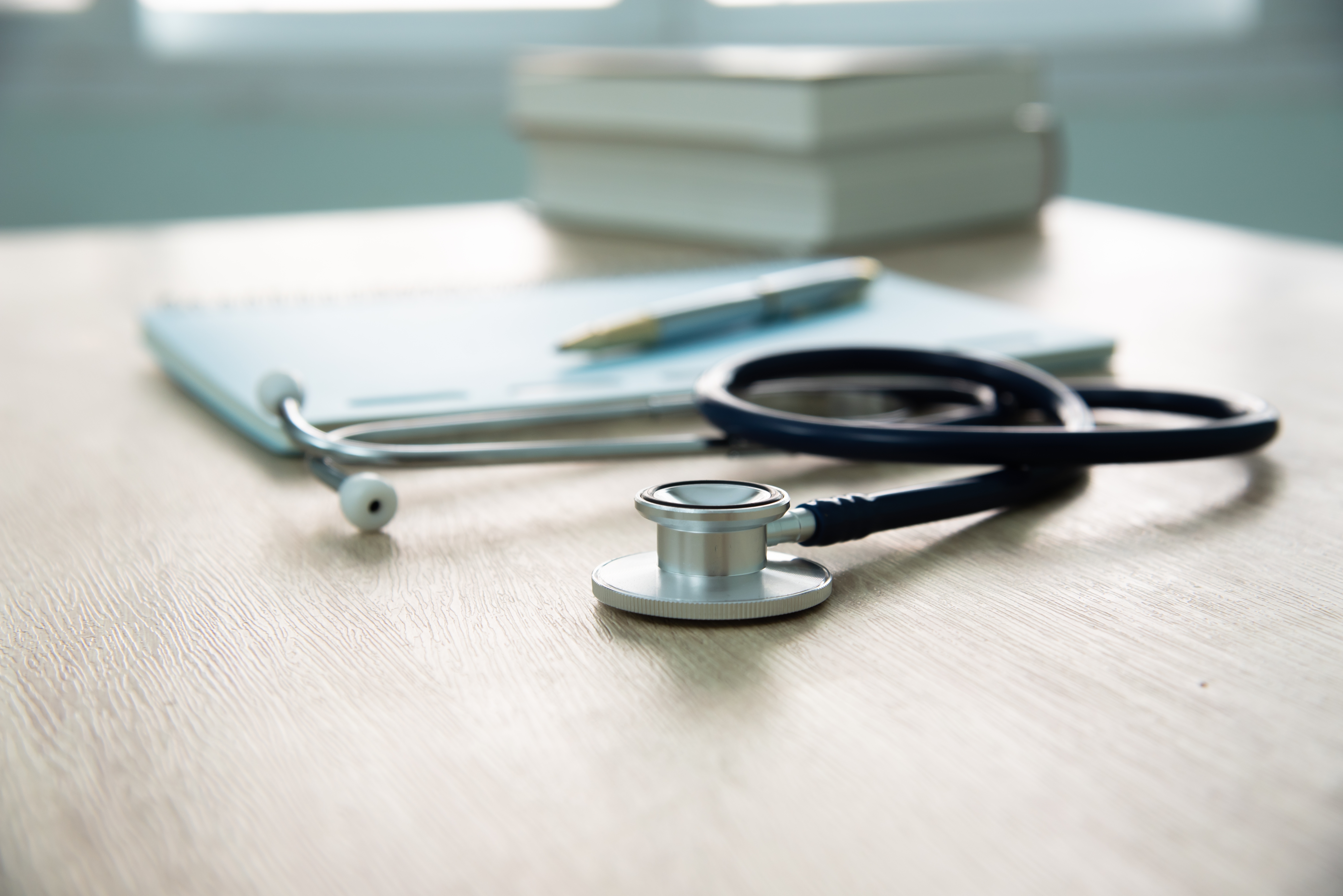 A stethoscope on a desk