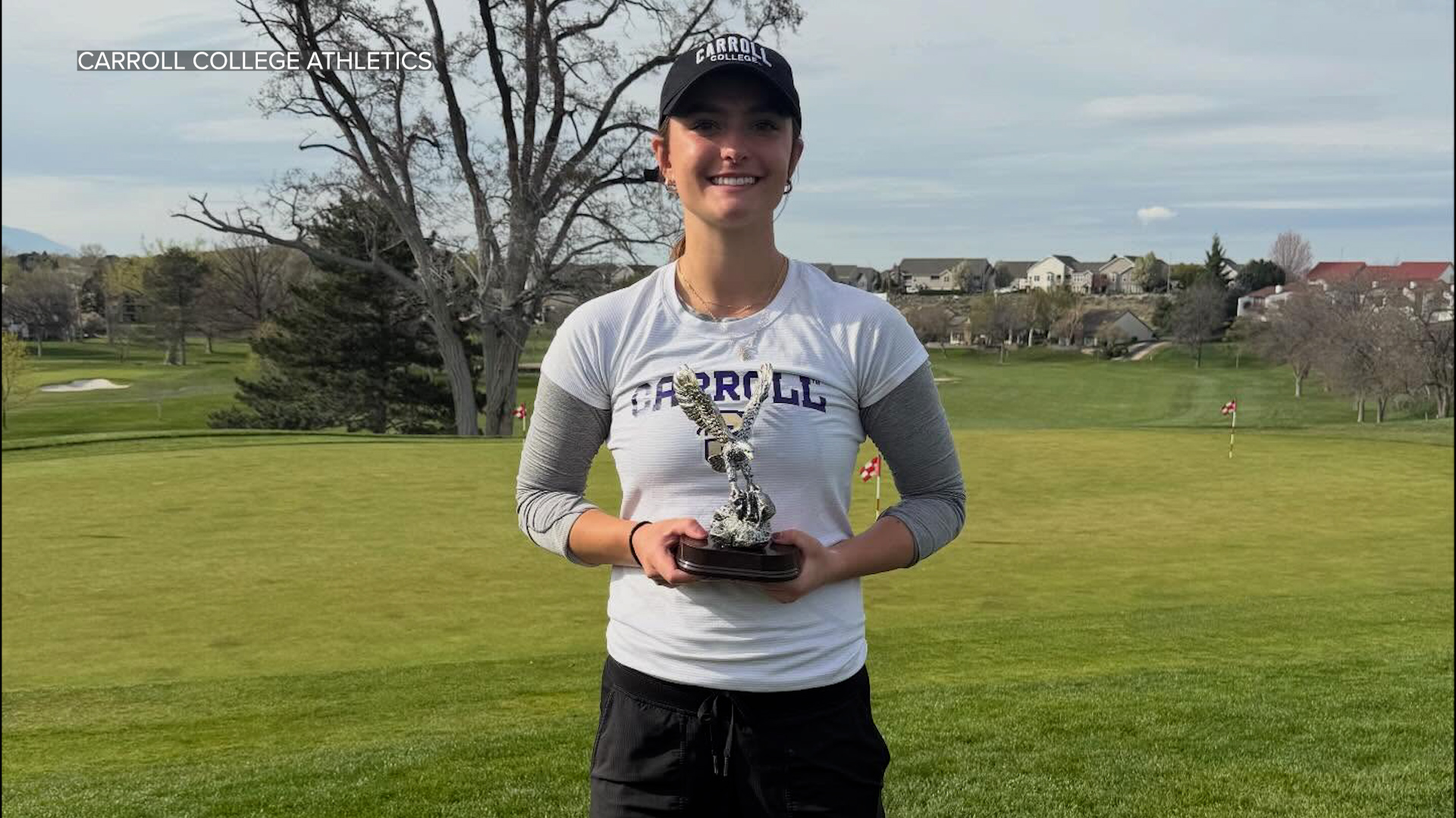 Carroll golfer Addison Slivinski poses with her trophy after winning the Columbia Basin College Invitational.