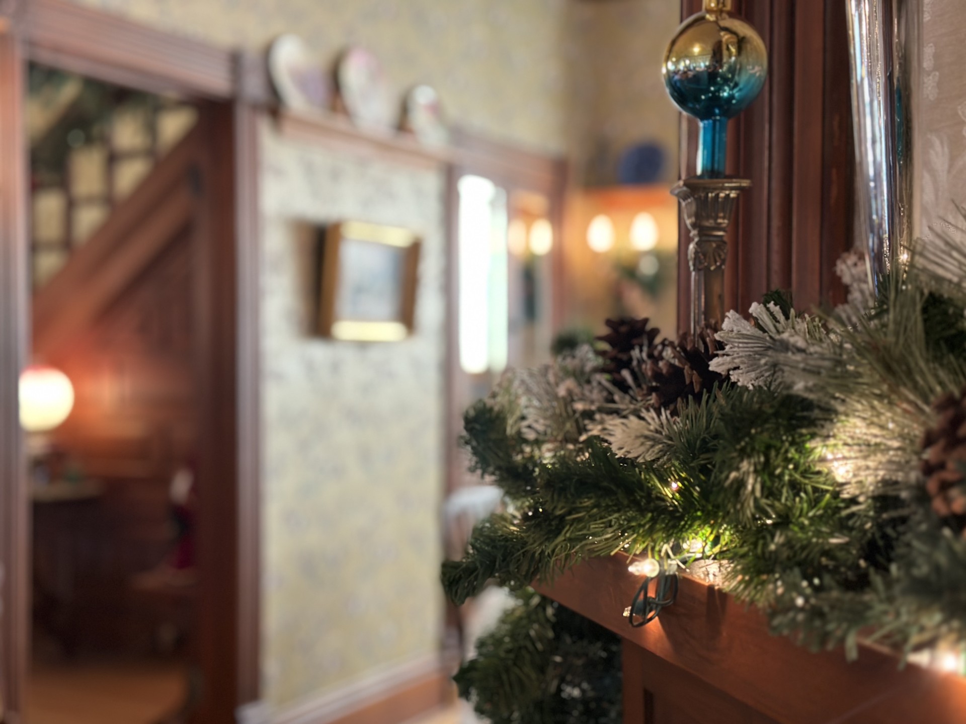 The holiday-time view from the living room into the dining room at the Bryant House.