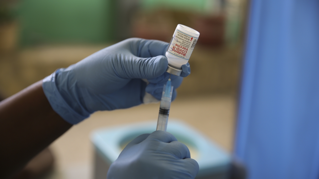 A medical worker prepares a shot of the Moderna vaccine