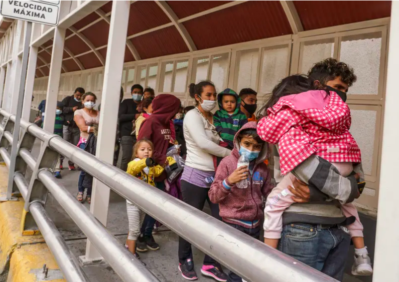Central American migrants who were apprehended crossing the Rio Grande in Brownsville were flown to El Paso for processing, then deported to Mexico across the Paso del Norte International Bridge on March 16, 2021..png