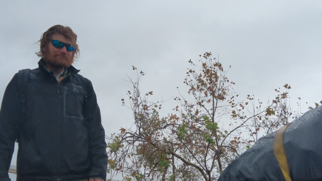 Lawrence DeWolf leaves the SD riverbed on Monday to get away from the possible flooding.