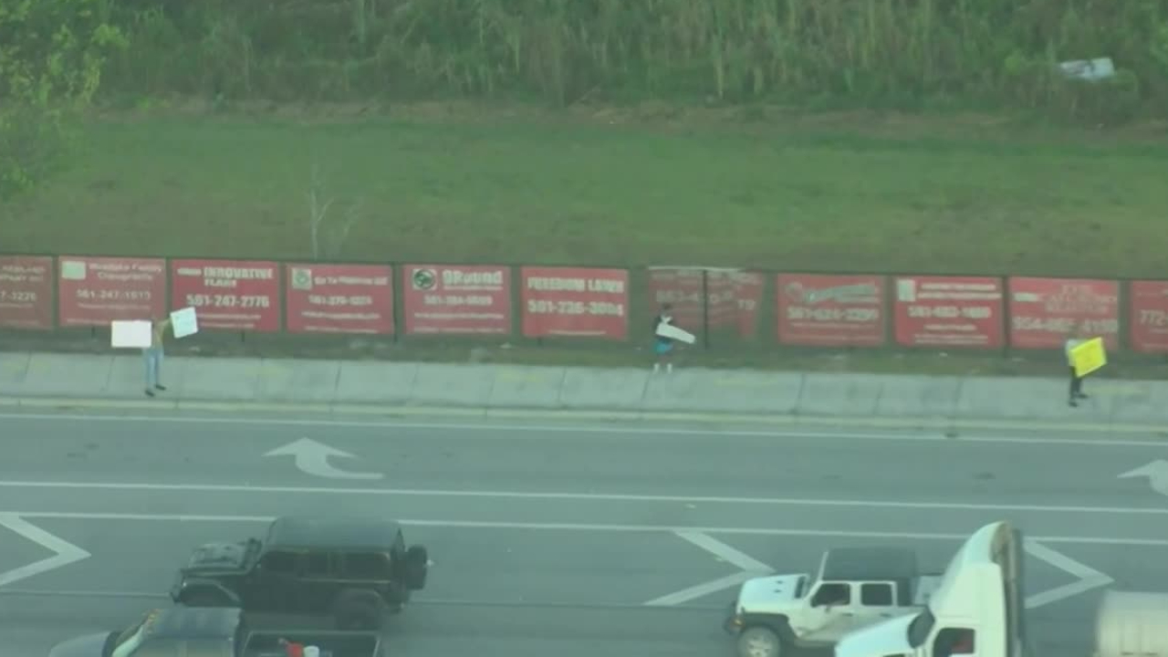 A group of people protest a new bathroom policy at Seminole Ridge Community High School on March 27, 2023.jpg