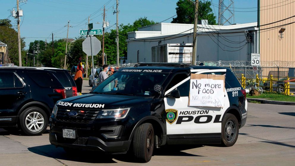 A sign on a police car lets passerby's know that there's no more food left a food distribution site at Reyes Produce April 13, 2020 in Houston, Texas.A sign on a police car lets passerby's know that there's no more food left a food distribution site at Reyes Produce April 13, 2020 in Houston, Texas.
Mark Felix/AFP /AFP via Getty Images
