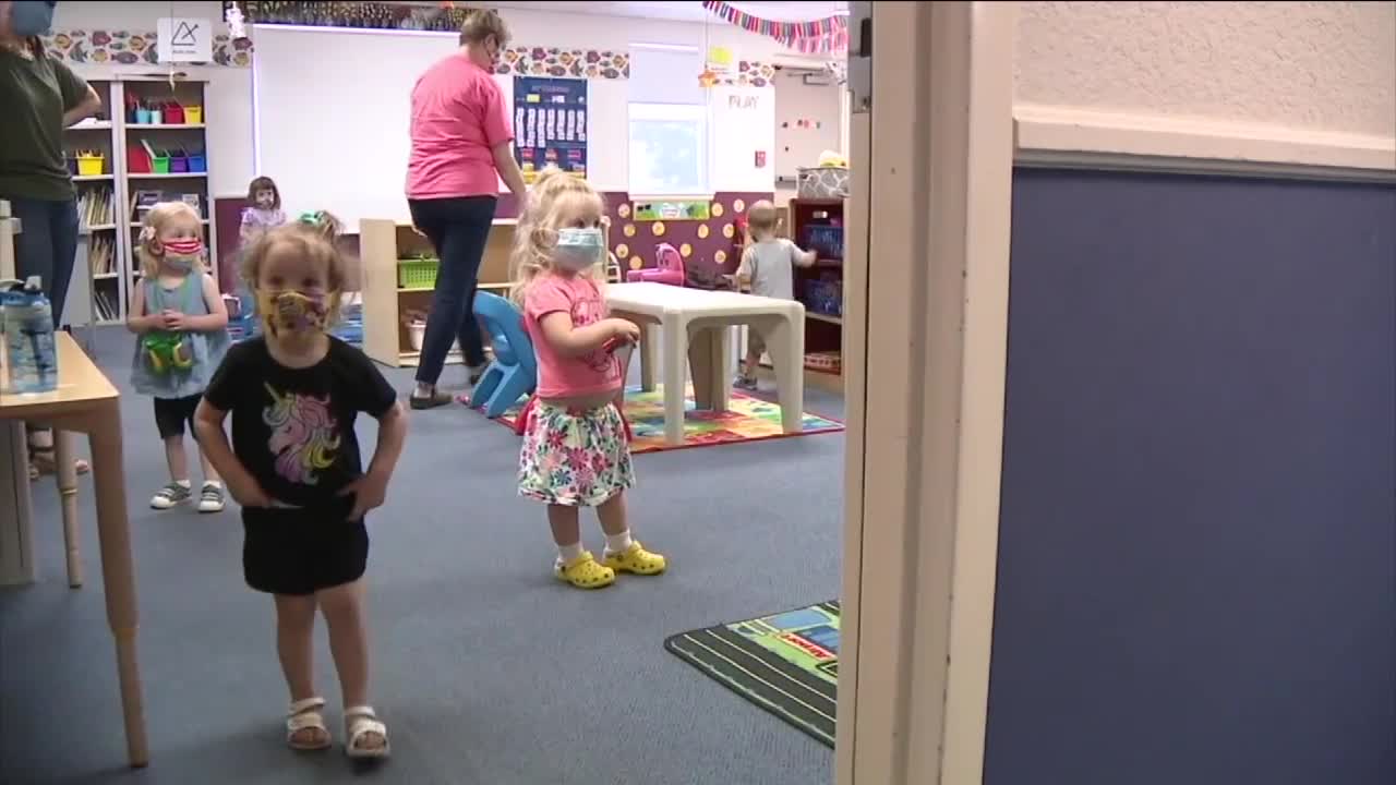 Young children in masks in childcare
