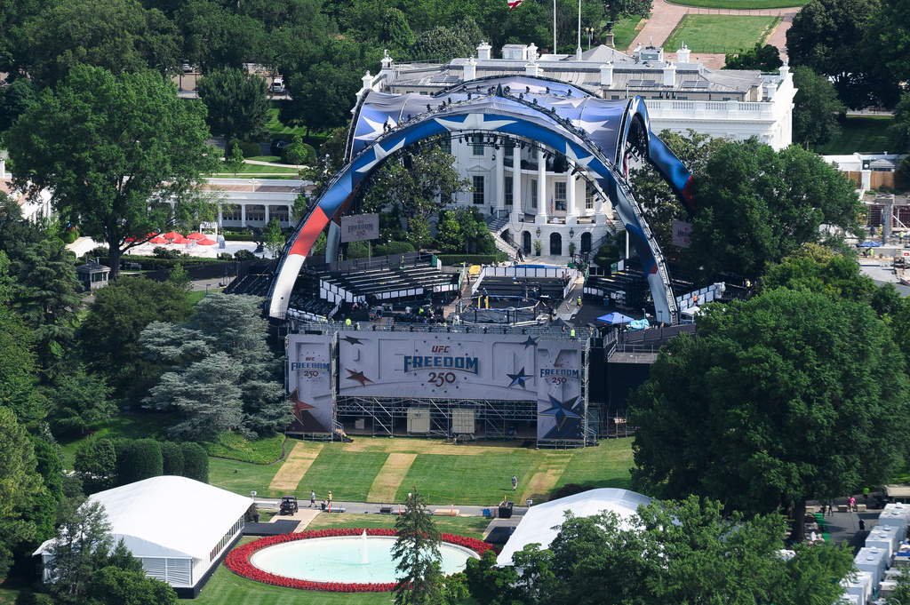 Workers continue building the stage for a future UFC fight on the South Lawn of the White House in Washington, Tuesday, June 9, 2026. 