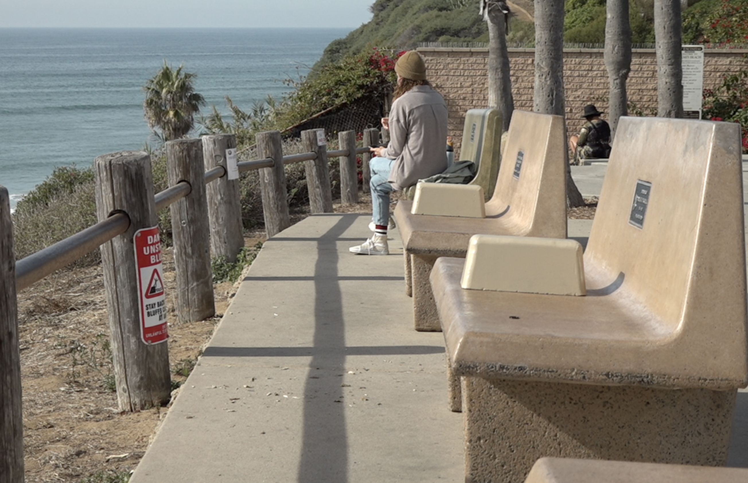 Seven benches with added arm rests returned above Swami's beach
