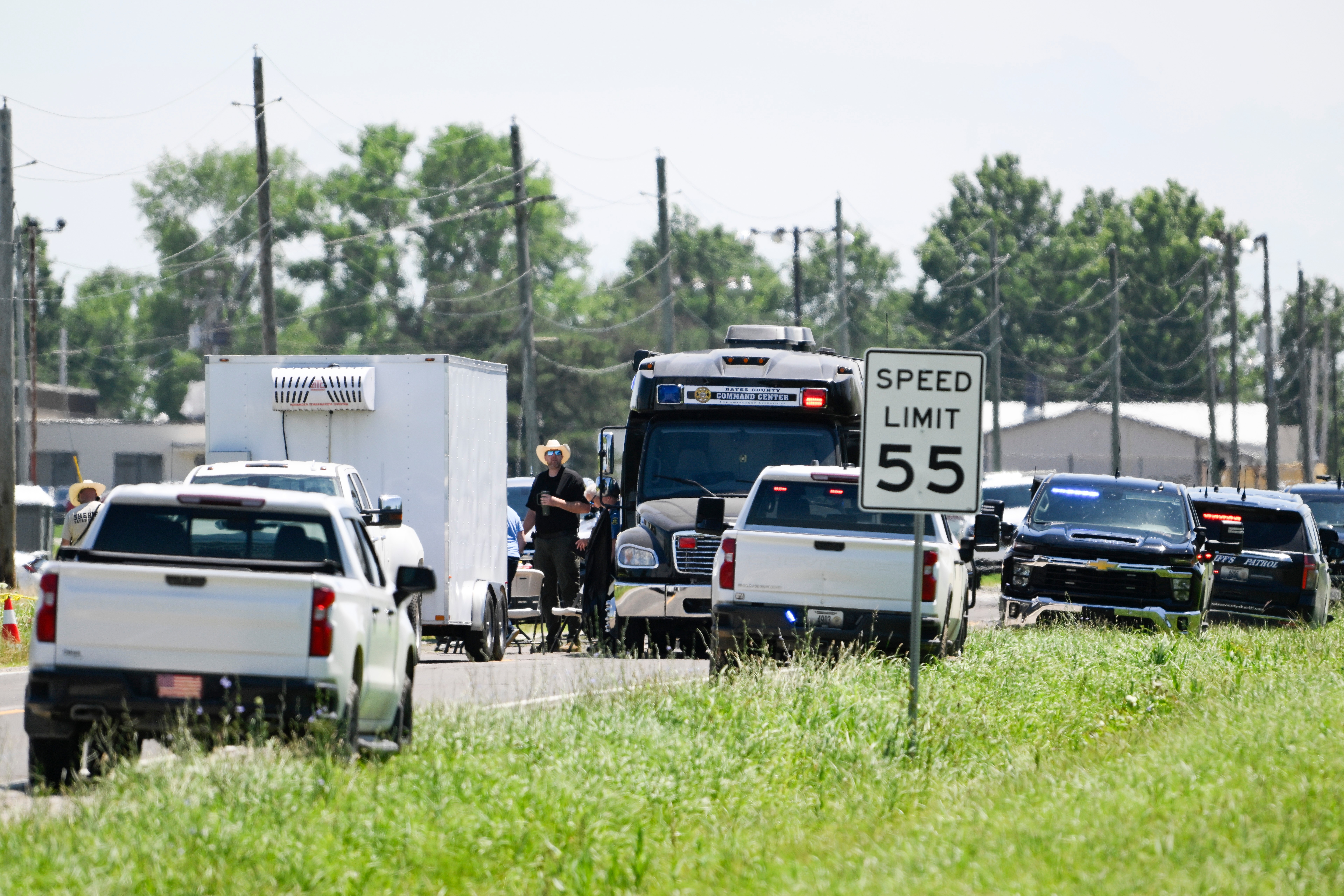 Emergency vehicles parked outside the Butler Memorial Airport after a plane crash in Butler, Mo., Sunday, June 14, 2026.