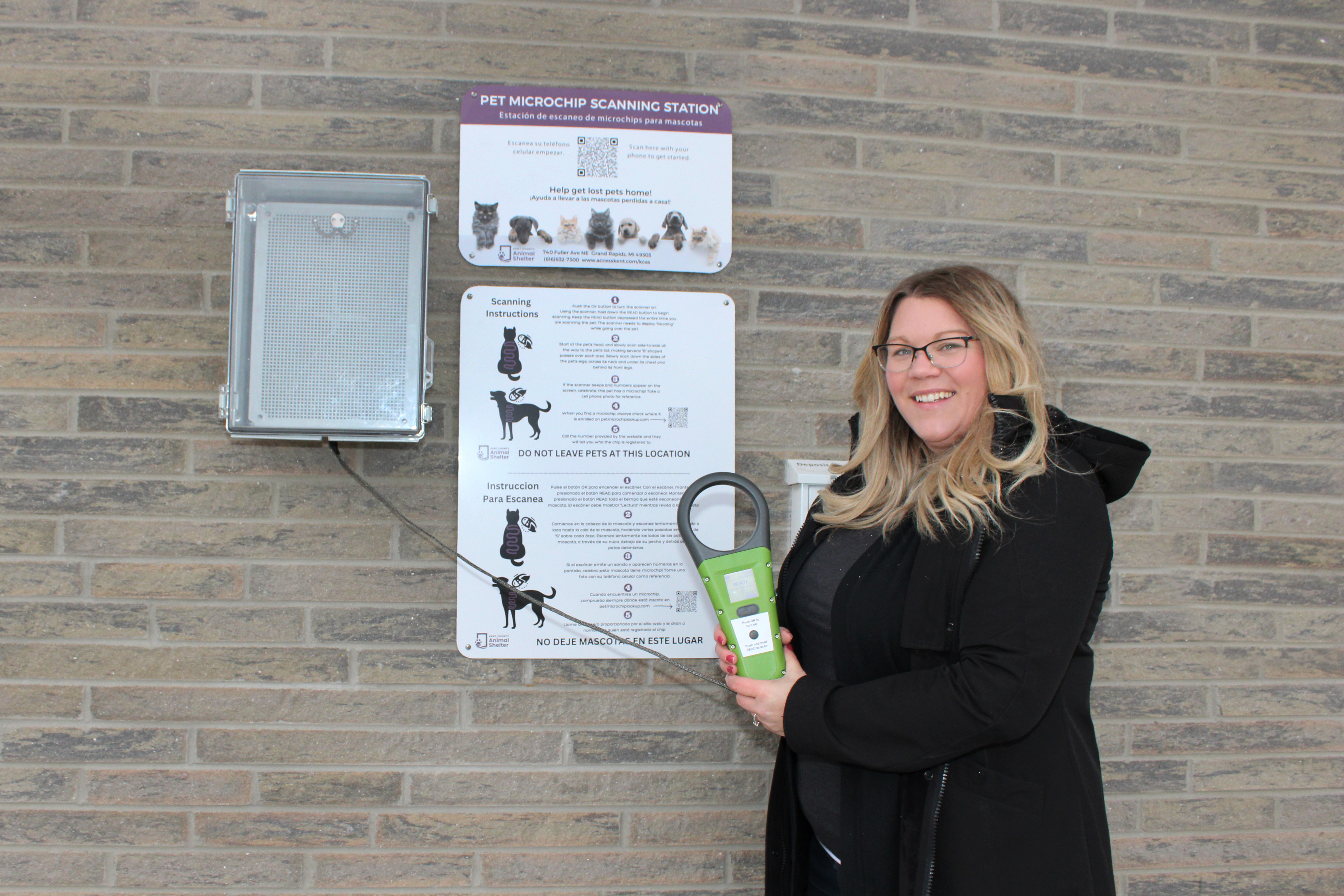 Angela Hollinshead in front of the microchip scanning station.JPG