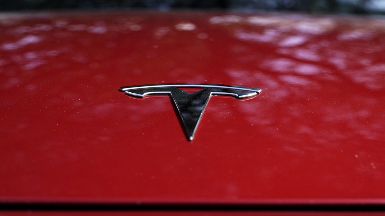 A Tesla logo seen on a vehicle.