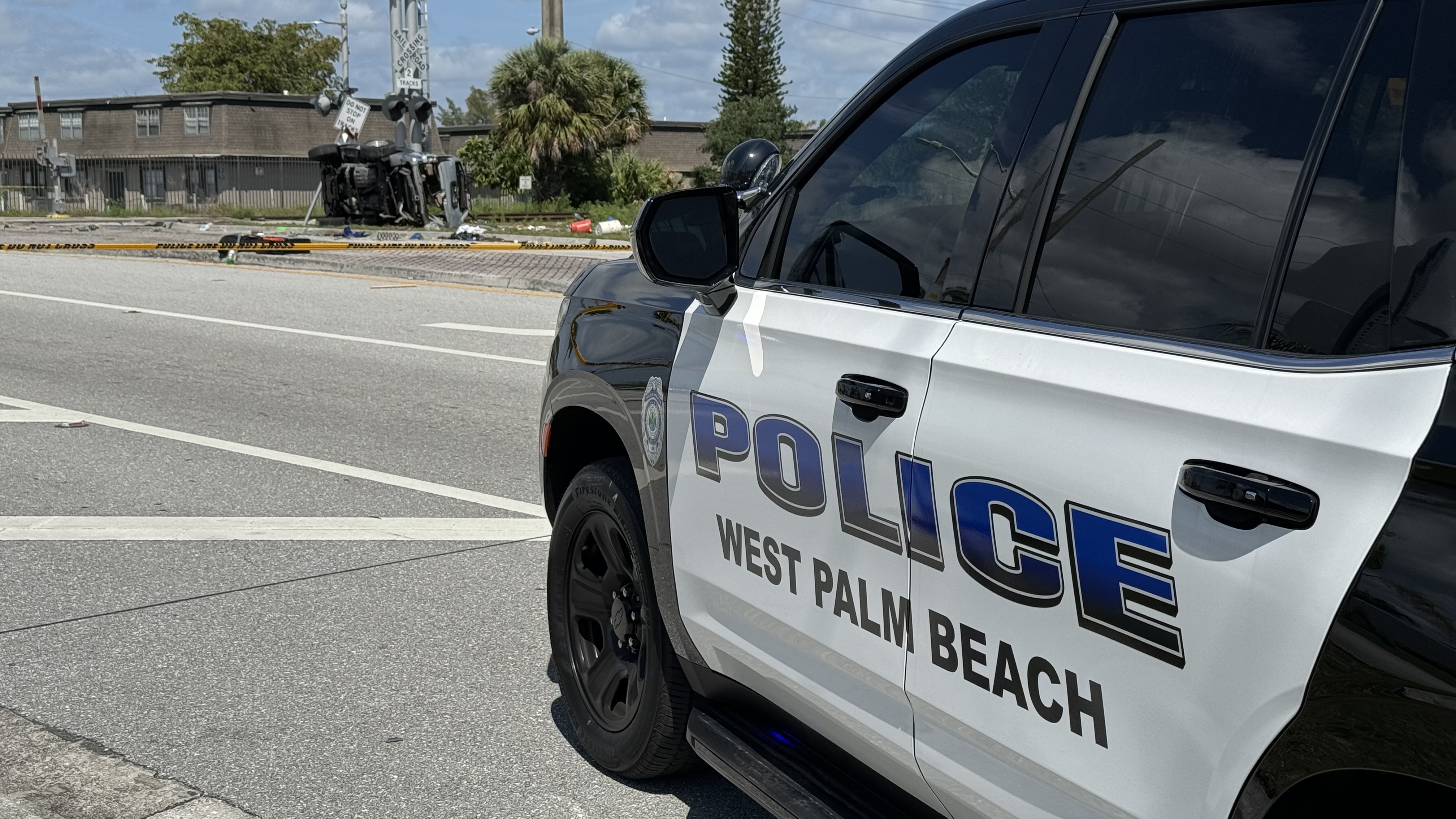 West Palm Beach police vehicle next to car struck by train, March 26, 2024