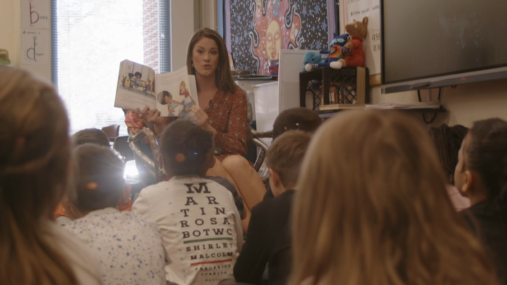 Brie Groves reading to students