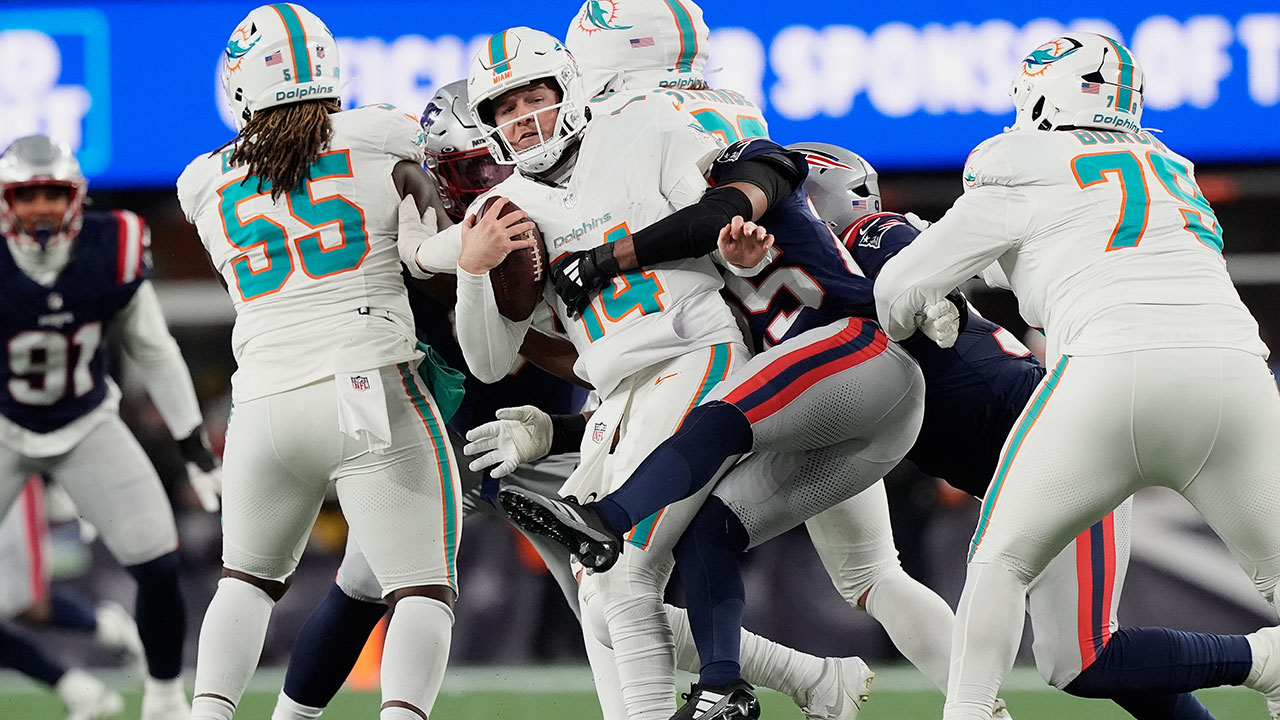 Miami Dolphins quarterback Quinn Ewers (14) is sacked by New England Patriots cornerback Marcus Jones (25) during the second half of an NFL football game in Foxborough, Mass., Sunday, Jan. 4, 2026. (AP Photo/Robert F. Bukaty)