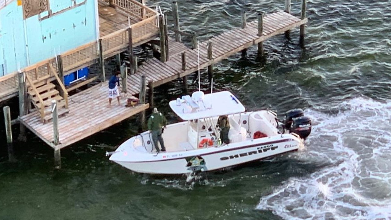 A missing Florida jet skier took refuge in a stilt house after he lost his water scooter attempting to save a bird caught in a wire. 