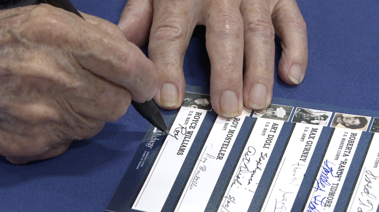 Signatures of World War II veterans collected during the event. 