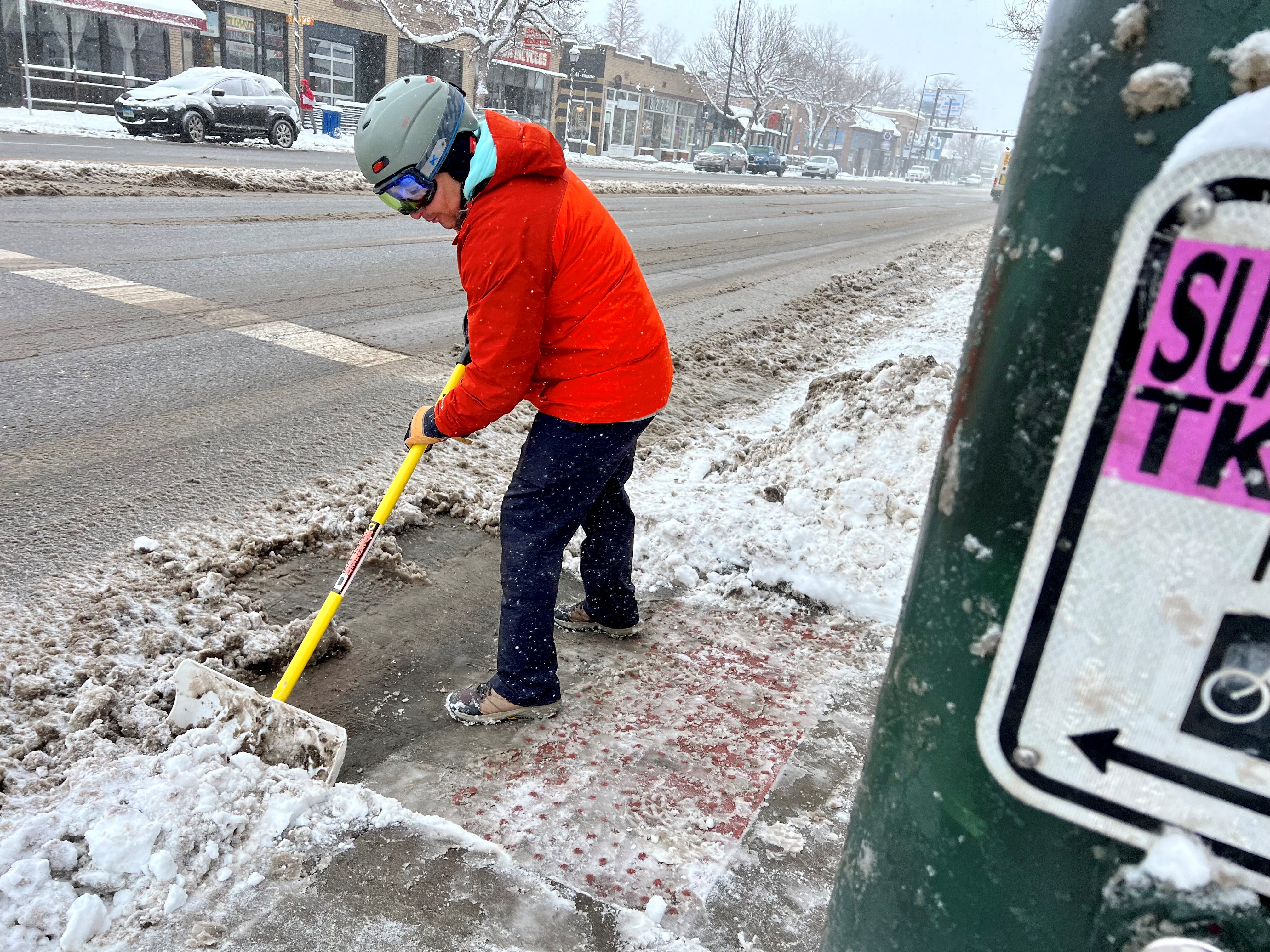Bryan Wilson shoveling snow