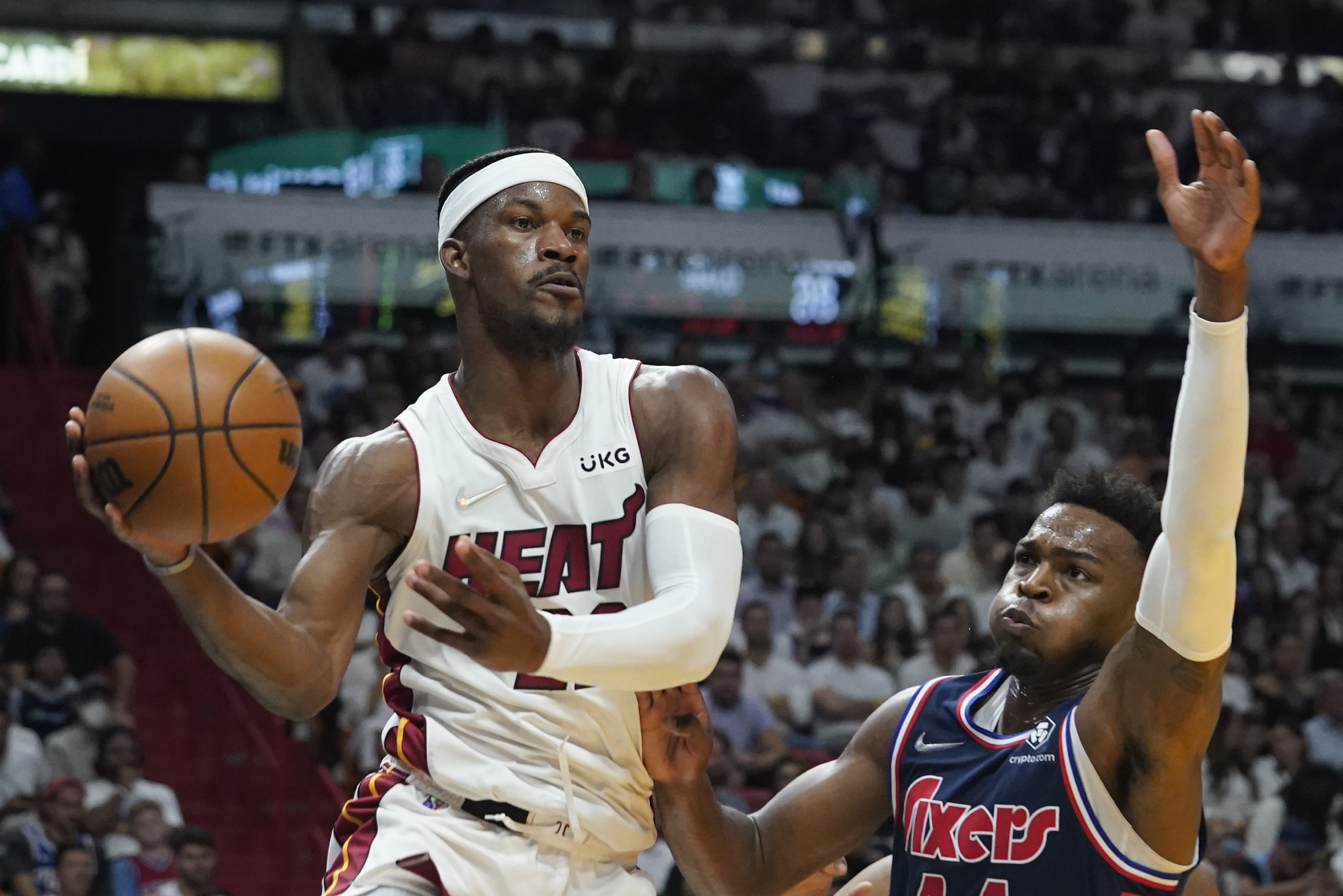 Miami Heat forward Jimmy Butler passes vs. Philadelpha 76ers forward Paul Reed, May 4, 2022