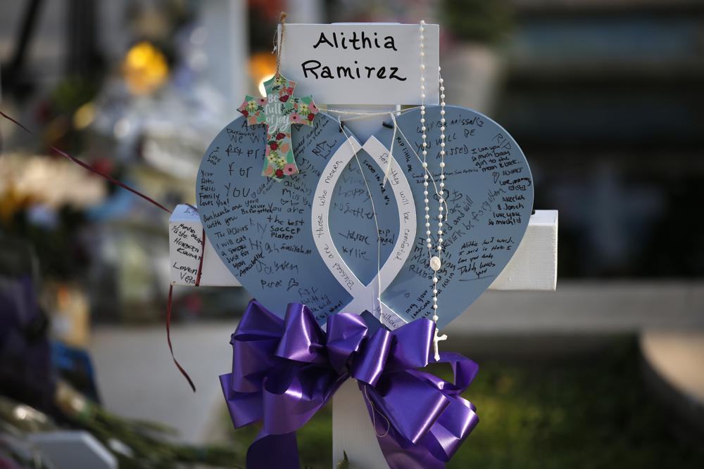 Alithia Ramirez's cross at memorial site for victims 
