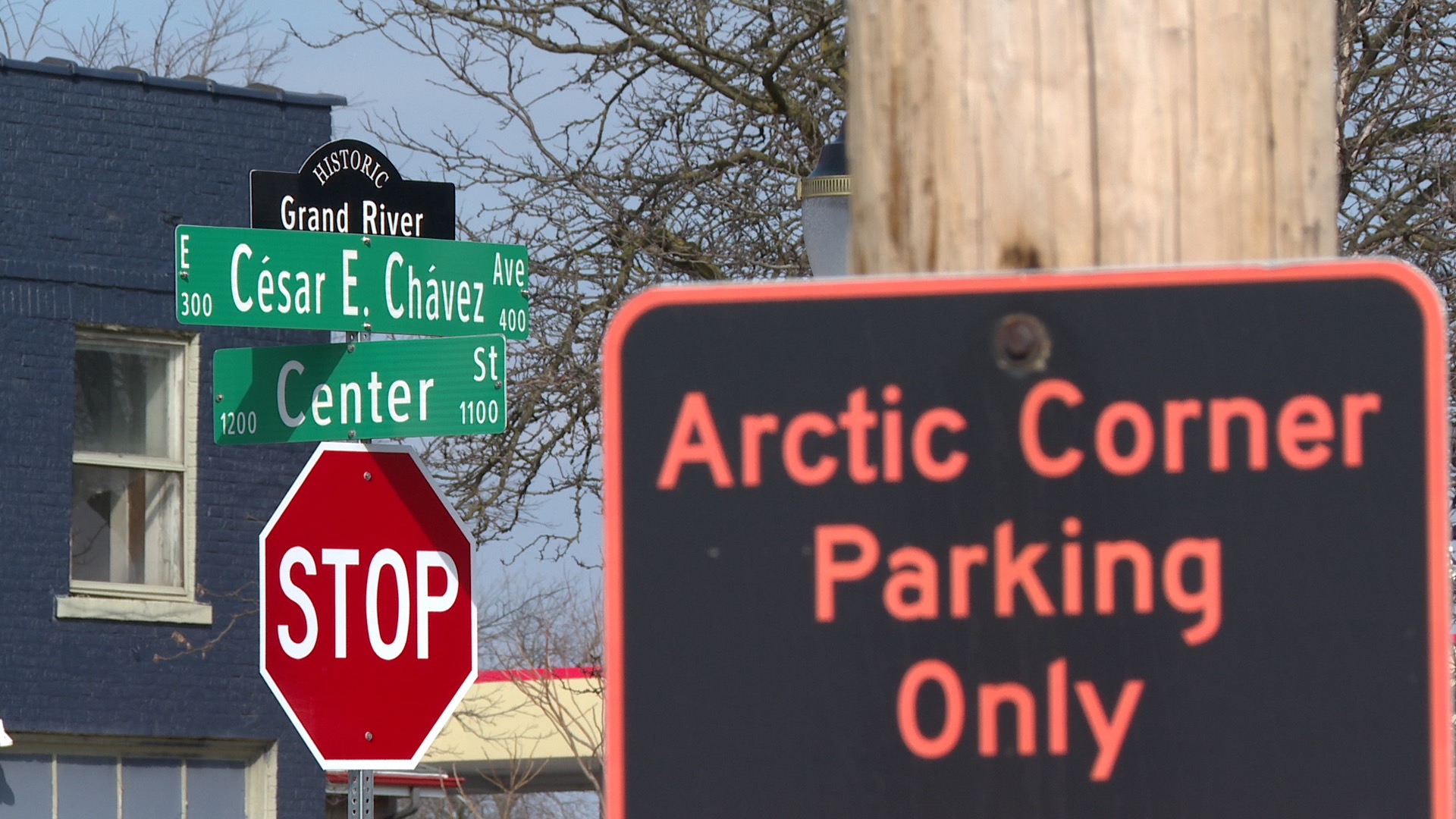 Arctic Corner parking sign with Cesar Chavez Avenue sign in the background