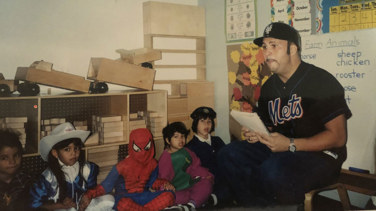 Enrique Vela teaches kindergarten children in Queens, New York