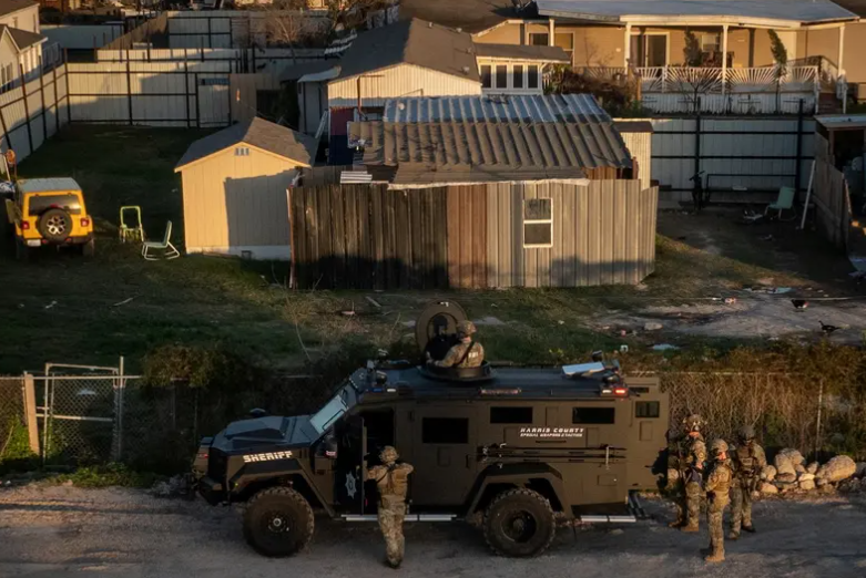FBI and Harris County law enforcement surround a Houston home on Jan. 1 hours after a resident of the city was suspected of launching a deadly attack in New Orleans. Gov. Greg Abbott is seeking to increase the state's anti-terrorism efforts in the wake of the attack. 