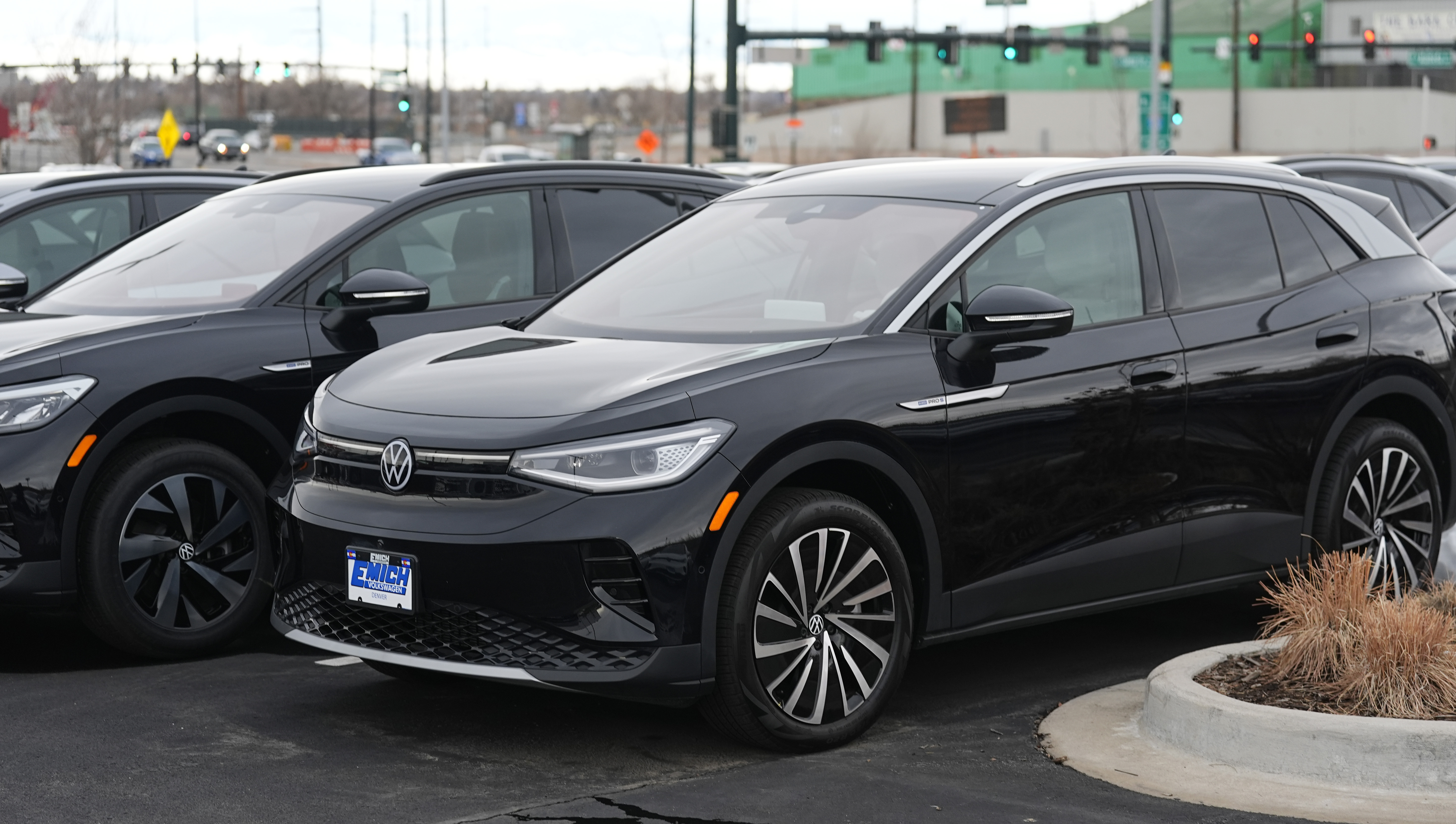 A line of unsold 2023 electric ID.4 sports-utility vehicles sit at a Volkswagen dealership Sunday, March 17, 2024, in Denver. 
