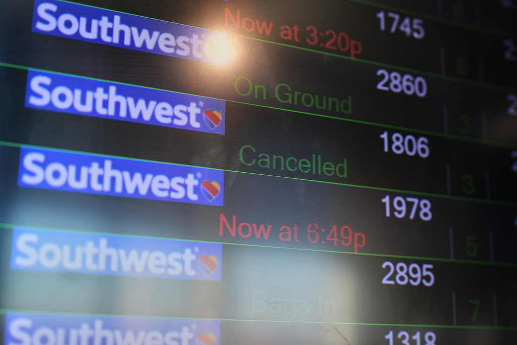 A flight cancelation is displayed on an information board in the terminal at Baltimore/Washington International Thurgood Marshall Airport in Baltimore.