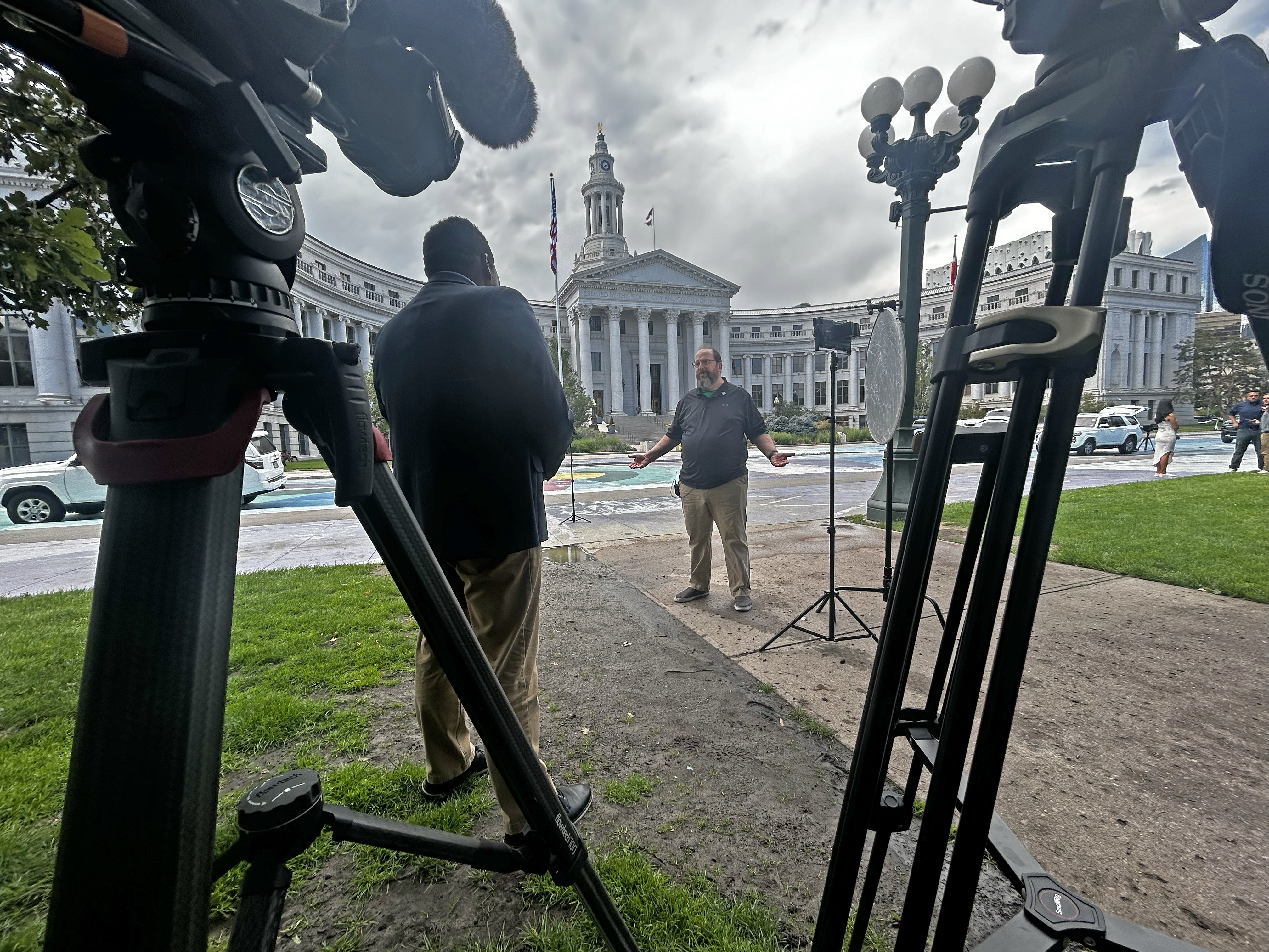 Brandon Richard talks with president of Local Union 158 Mike Wallin about Denver city cuts