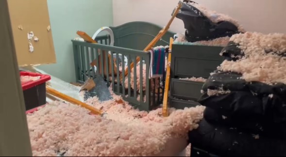 A crib punctured by a piece of wood from a tornado in Clarksville, Tennessee. 