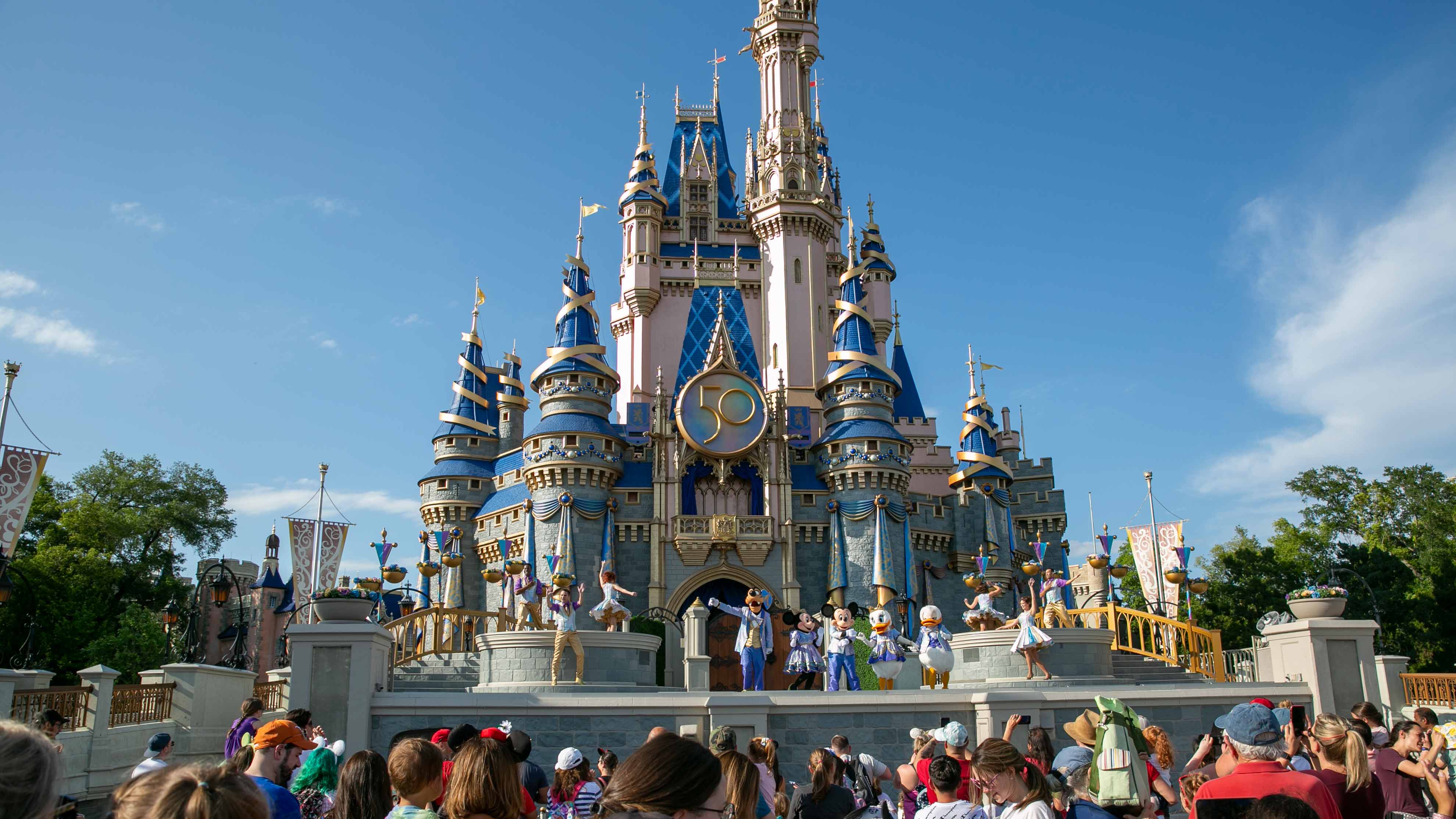 Performers dressed as Mickey Mouse, Minnie Mouse, Goofy, Donald Duck and Daisy Duck entertain visitors at Cinderella Castle at Walt Disney World Resort in Lake Buena Vista, Florida, on April 18, 2022. Florida lawmakers will move to increase state control of Walt Disney World's private government, according to a notice published Friday, Jan. 6, 2023, that marks the latest development in a feud over a law critics call "Don't Say Gay."